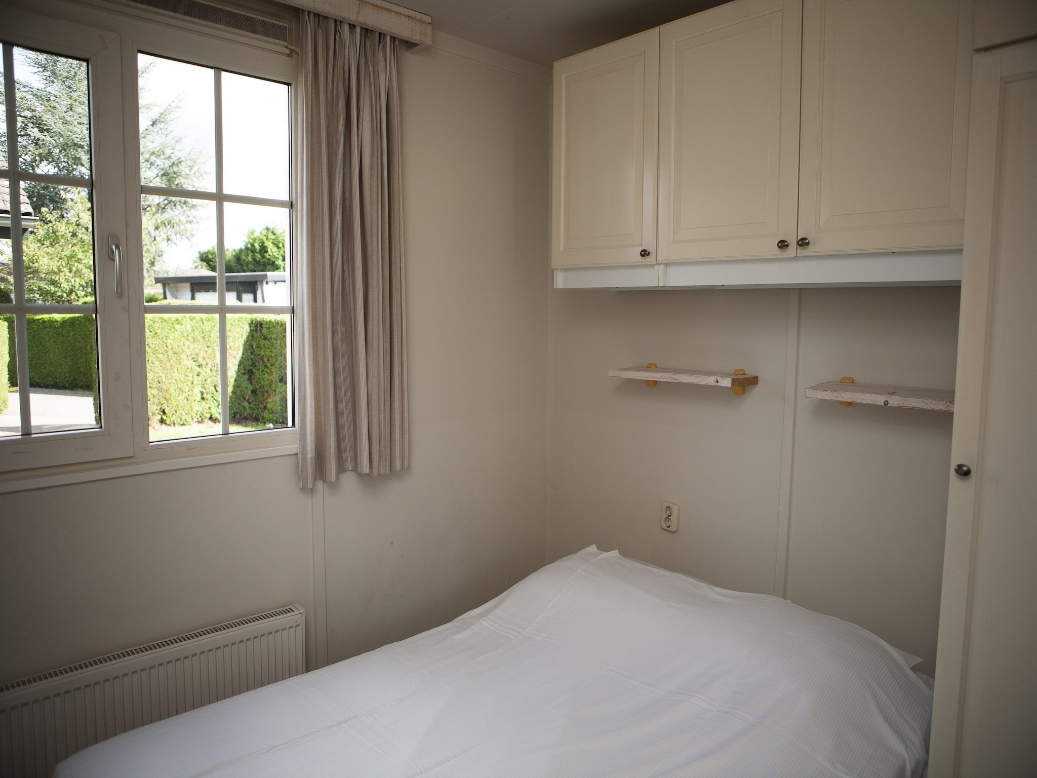 Een slaapkamer van Recreatiepark de Boshoek 10 in Voorthuizen