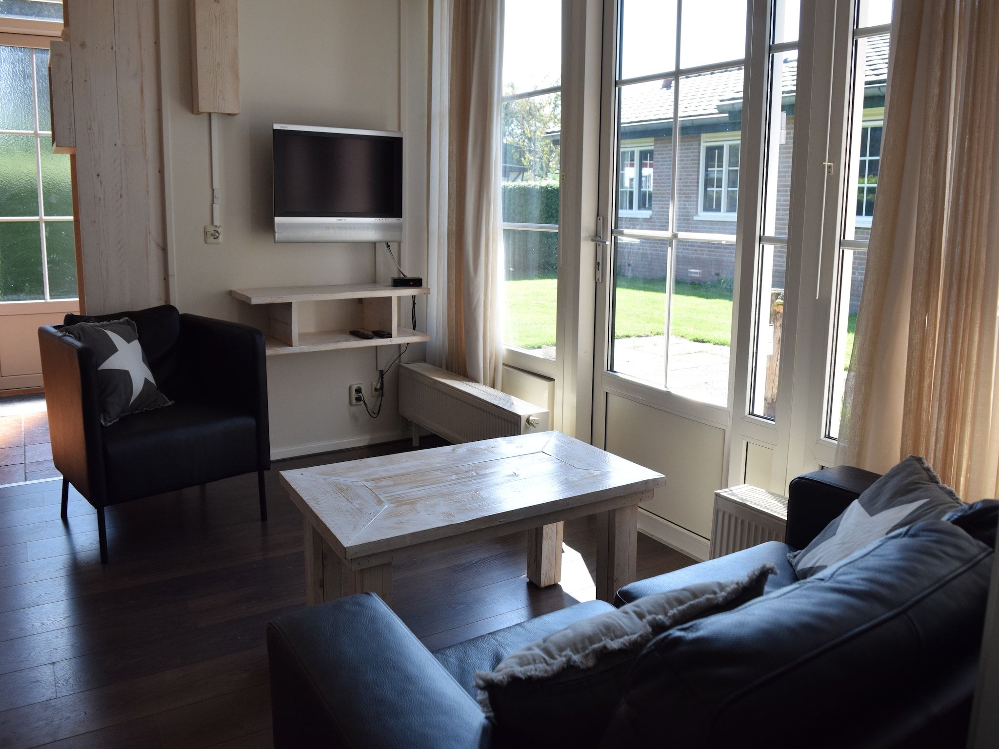 De woonkamer van Recreatiepark de Boshoek 10 in Voorthuizen