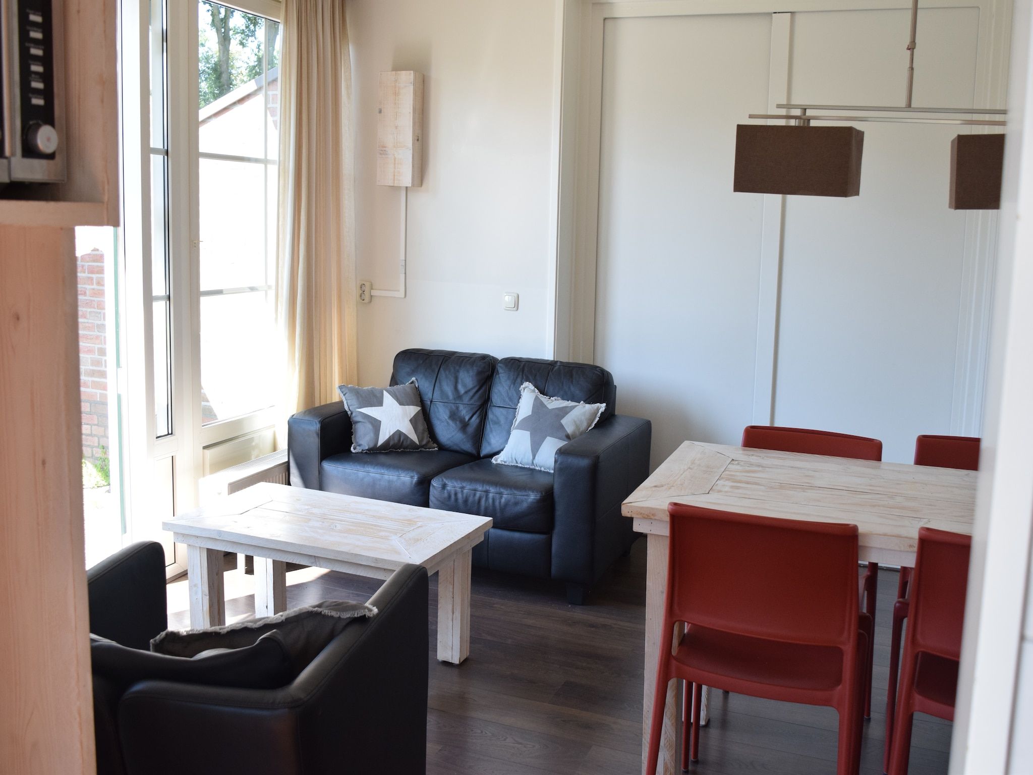 De woonkamer van Recreatiepark de Boshoek 10 in Voorthuizen