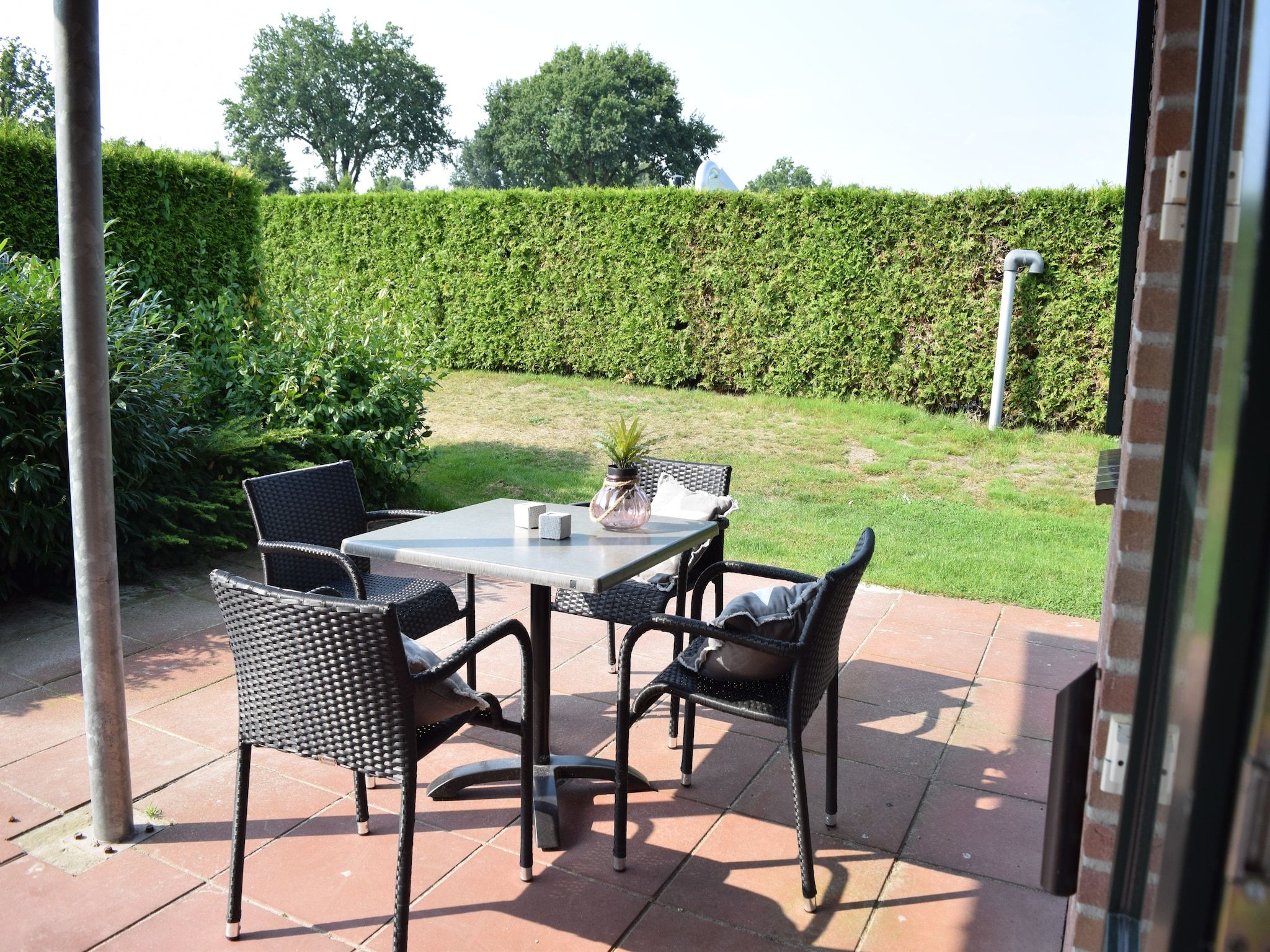 De tuin van Recreatiepark de Boshoek 12 in Voorthuizen