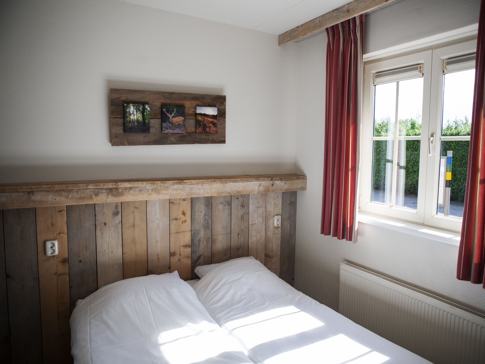 Een slaapkamer van Recreatiepark de Boshoek 12 in Voorthuizen