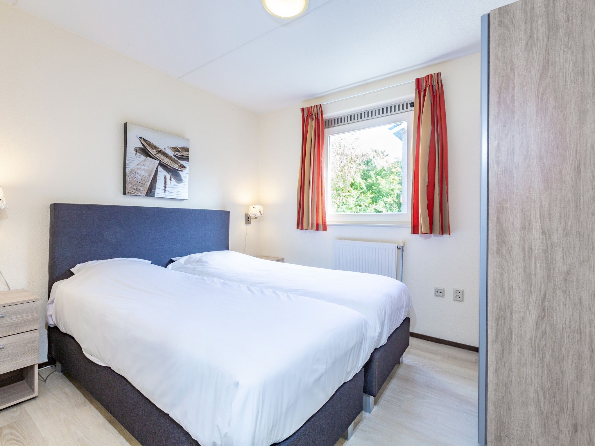 Een slaapkamer van Vakantiepark Kijkduin 8 in Den Haag