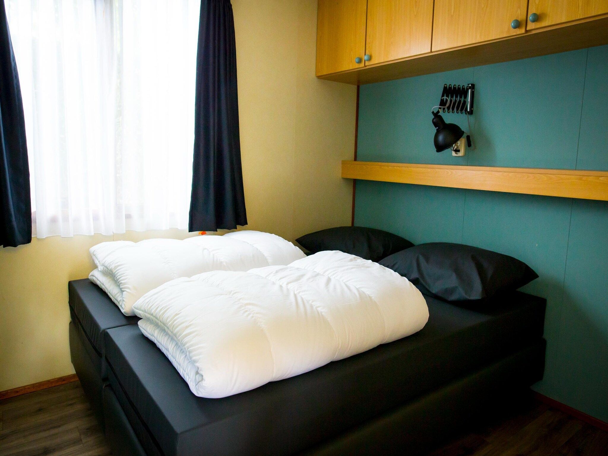 Een slaapkamer van Recreatiepark Duinhoeve 3 in Udenhout