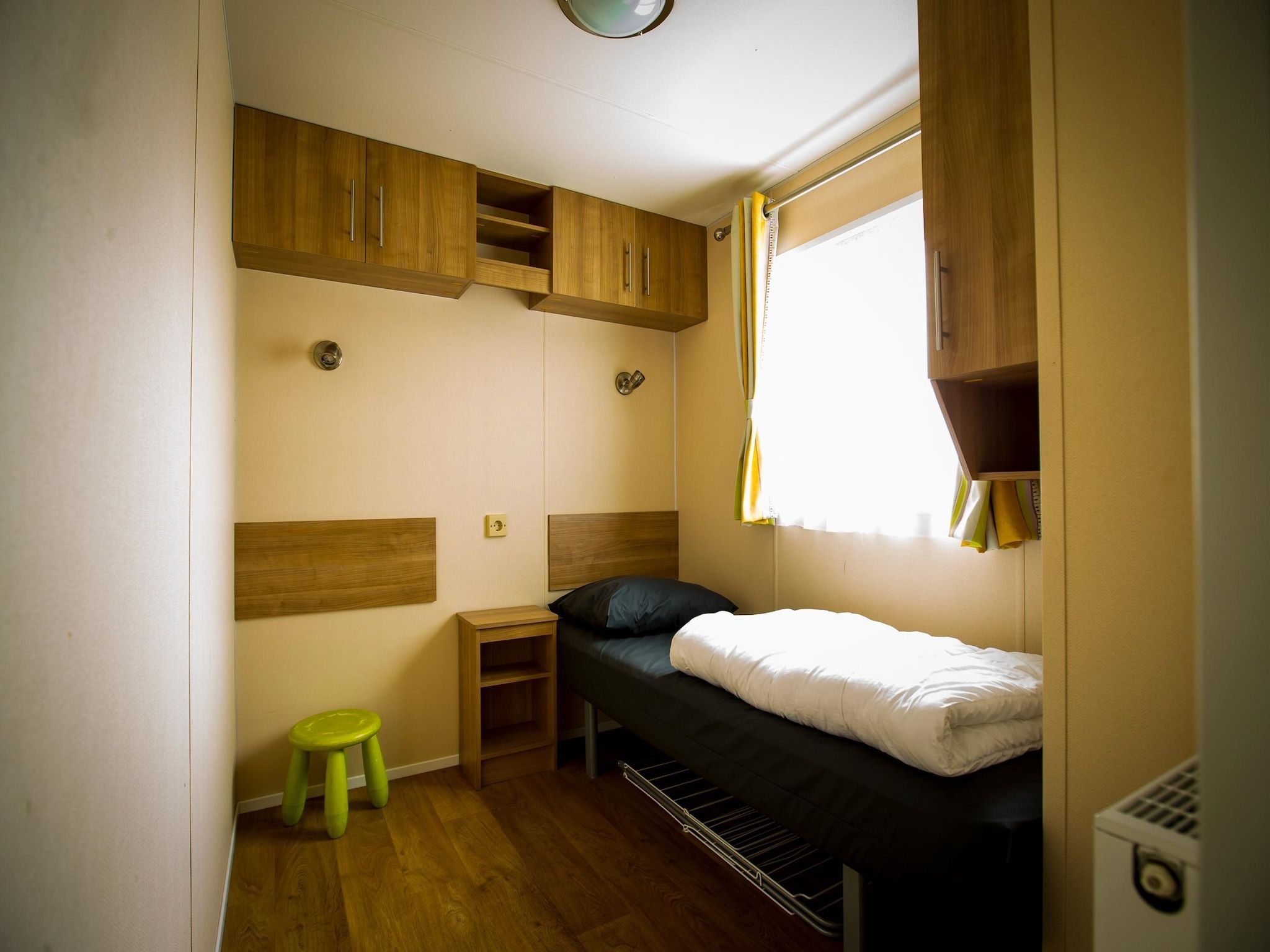 Een slaapkamer van Recreatiepark Duinhoeve 4 in Udenhout