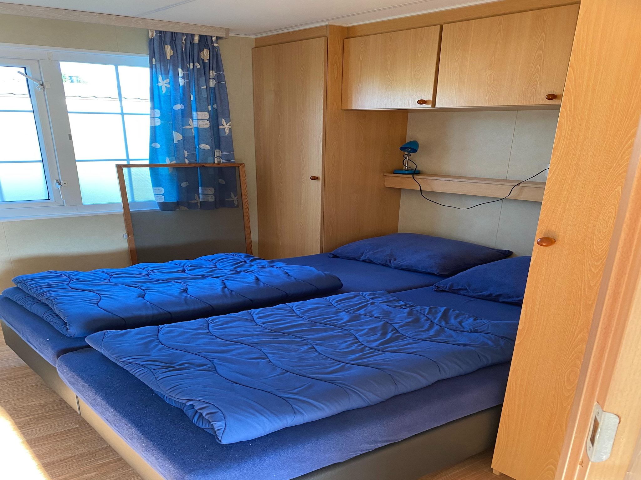 Een slaapkamer van Recreatiepark Duinhoeve 5 in Udenhout