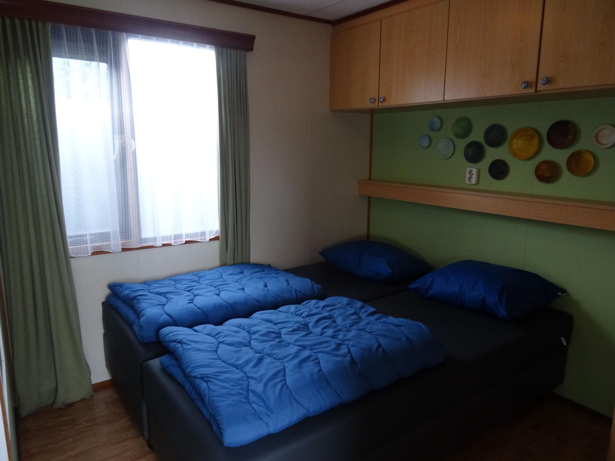 Een slaapkamer van Recreatiepark Duinhoeve 6 in Udenhout