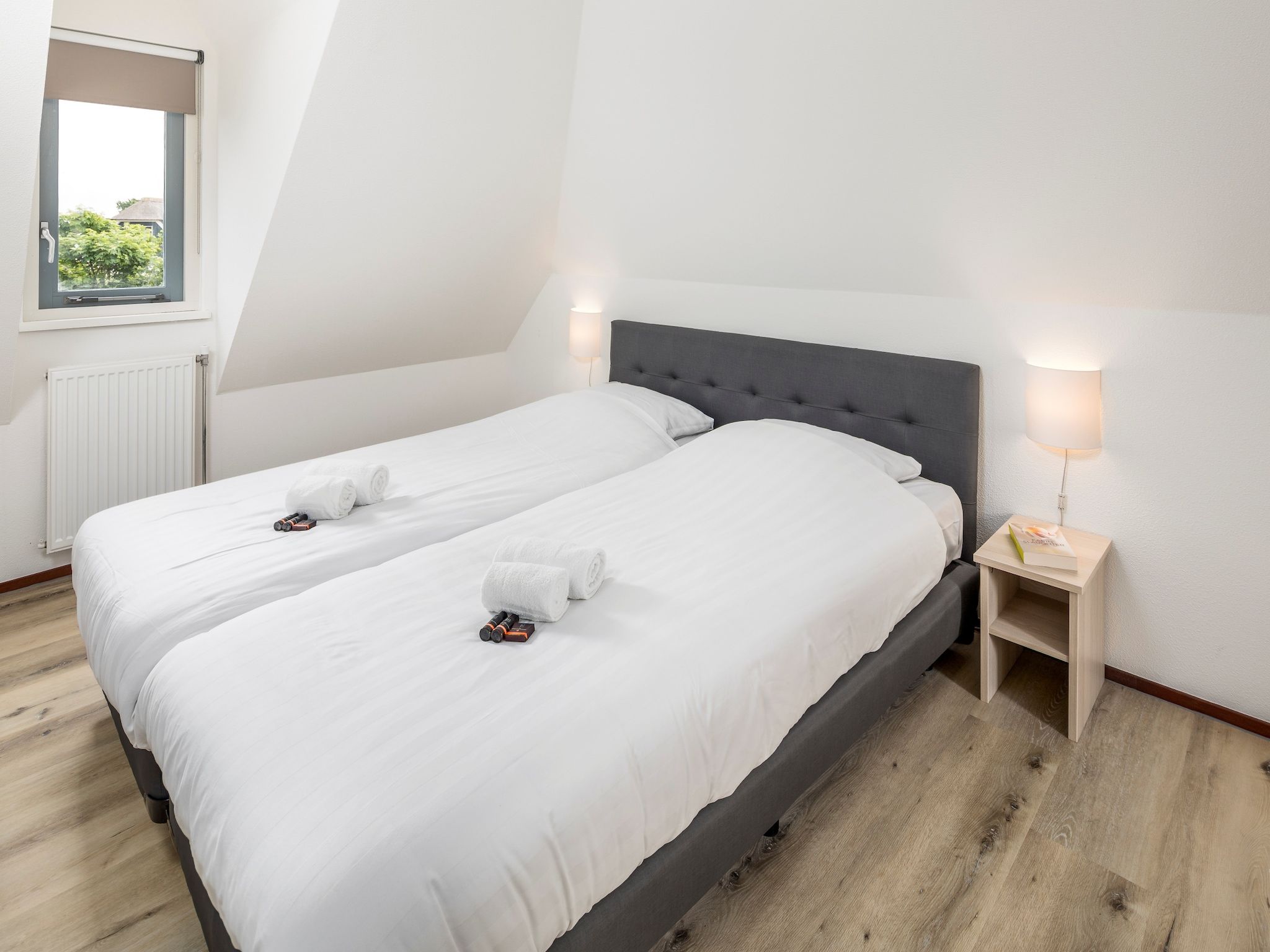 Een slaapkamer van Vakantiepark Duynzicht 1 in Julianadorp