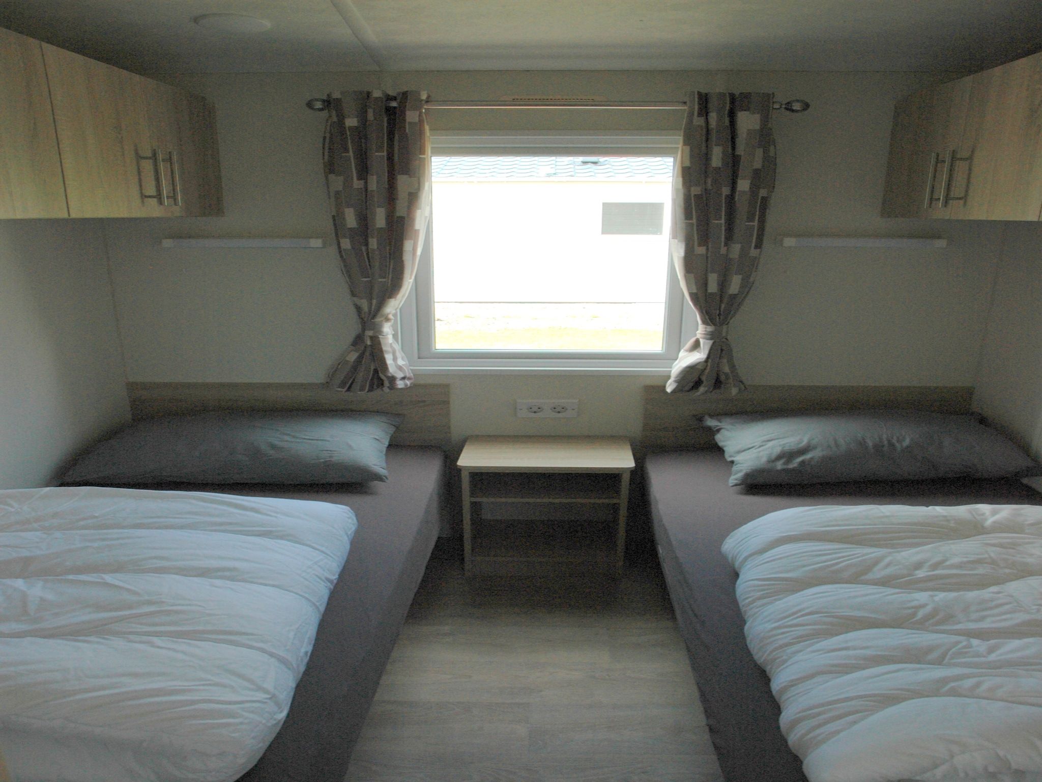 Een slaapkamer van Recreatiepark Duinhoeve 9 in Udenhout