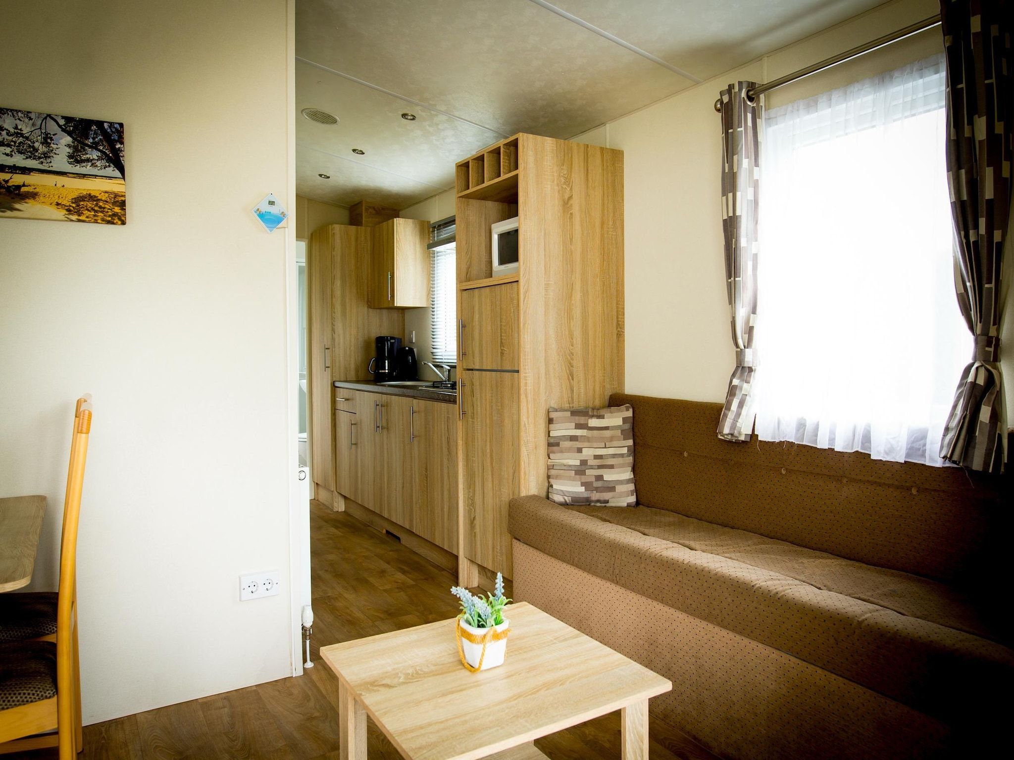 De woonkamer van Recreatiepark Duinhoeve 9 in Udenhout