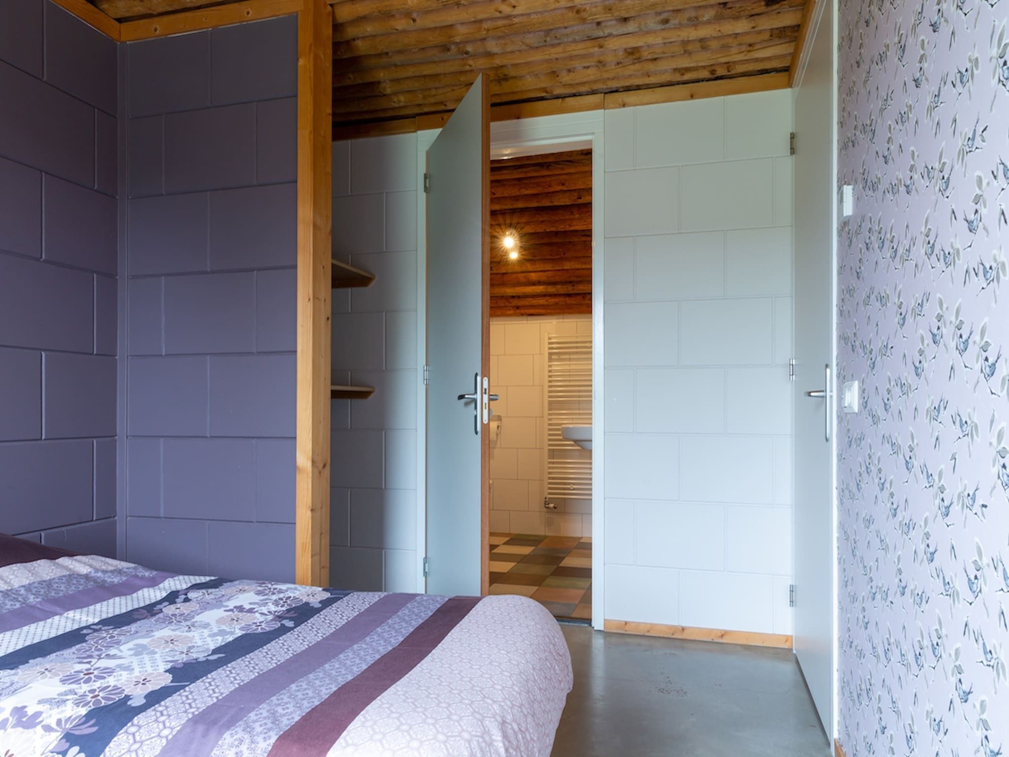 Een slaapkamer van Koe in de Kost 3 in Heeten