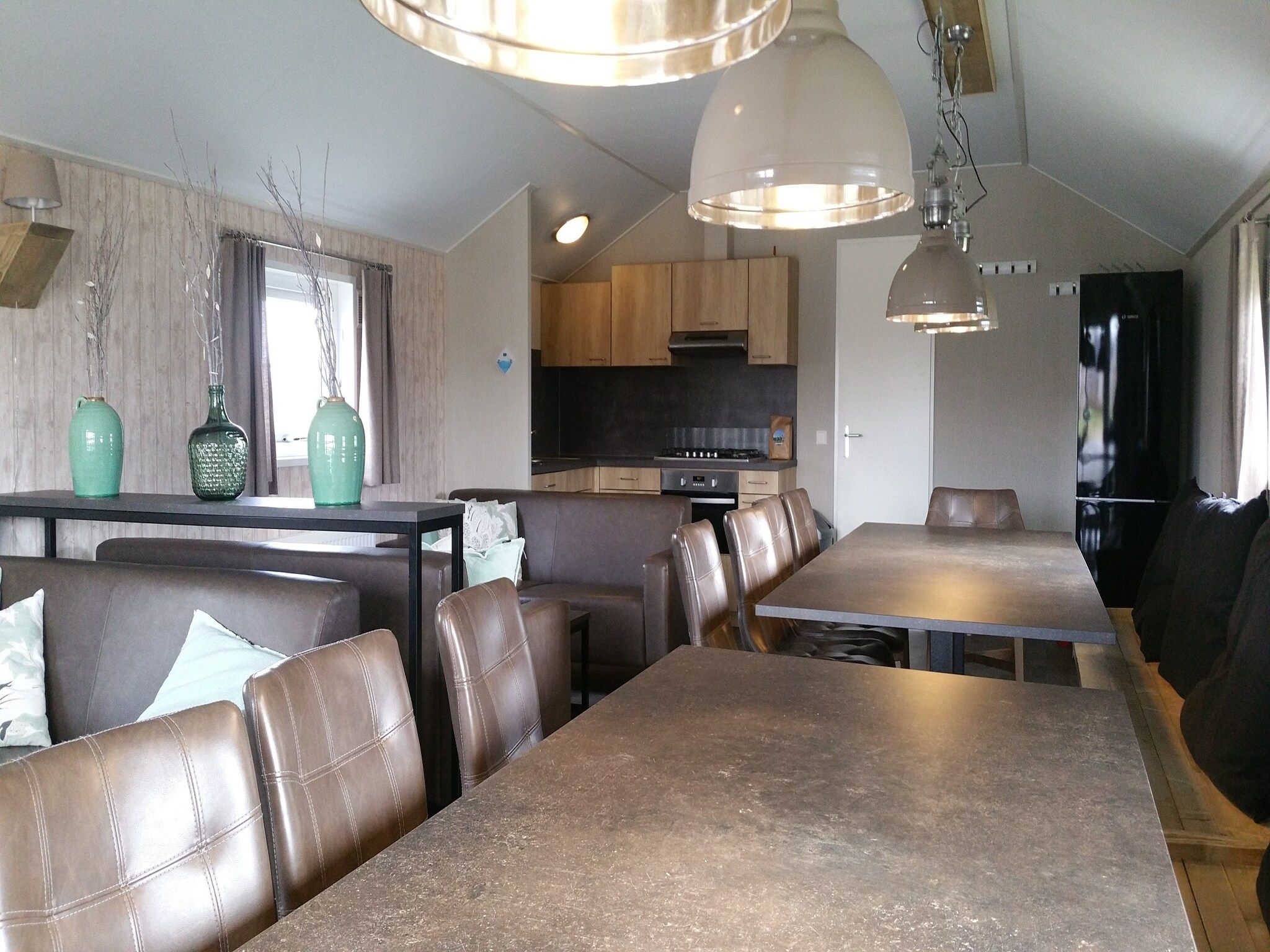 De woonkamer van Vakantiepark Eigen Wijze 8 in Bant