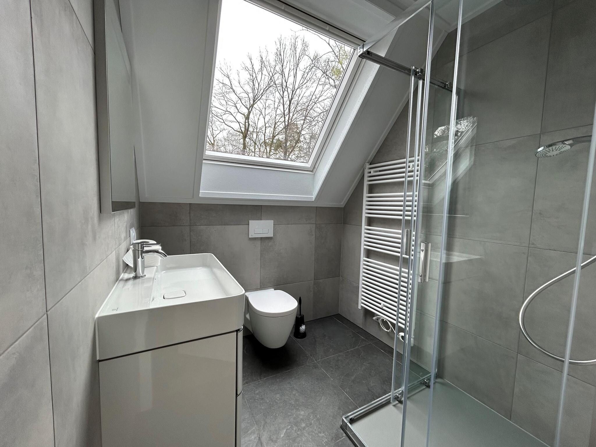 De badkamer van Vakantiepark De Rimboe & De Woeste Hoogte 2 in Hoenderloo