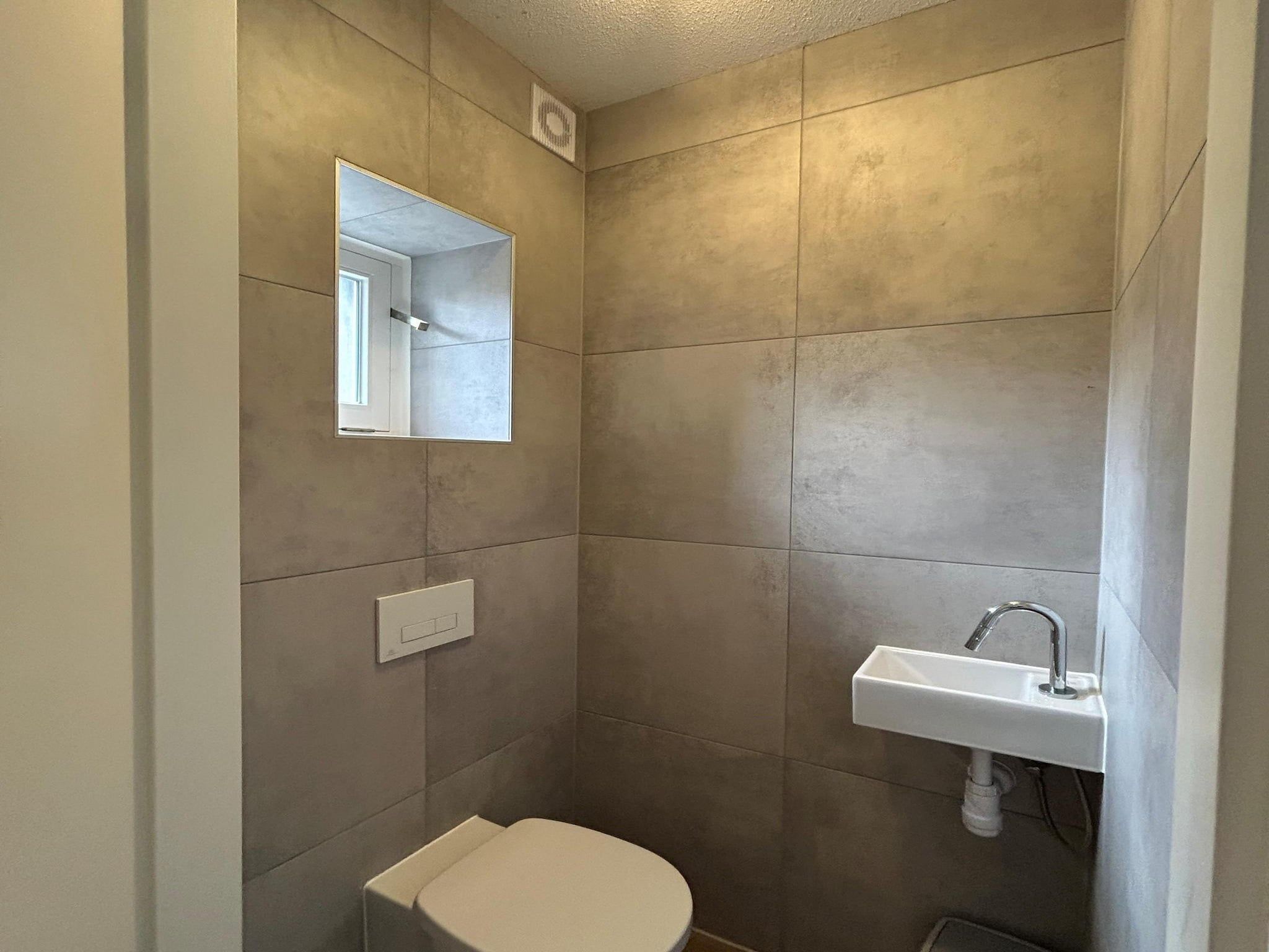 De badkamer van Vakantiepark De Rimboe & De Woeste Hoogte 2 in Hoenderloo