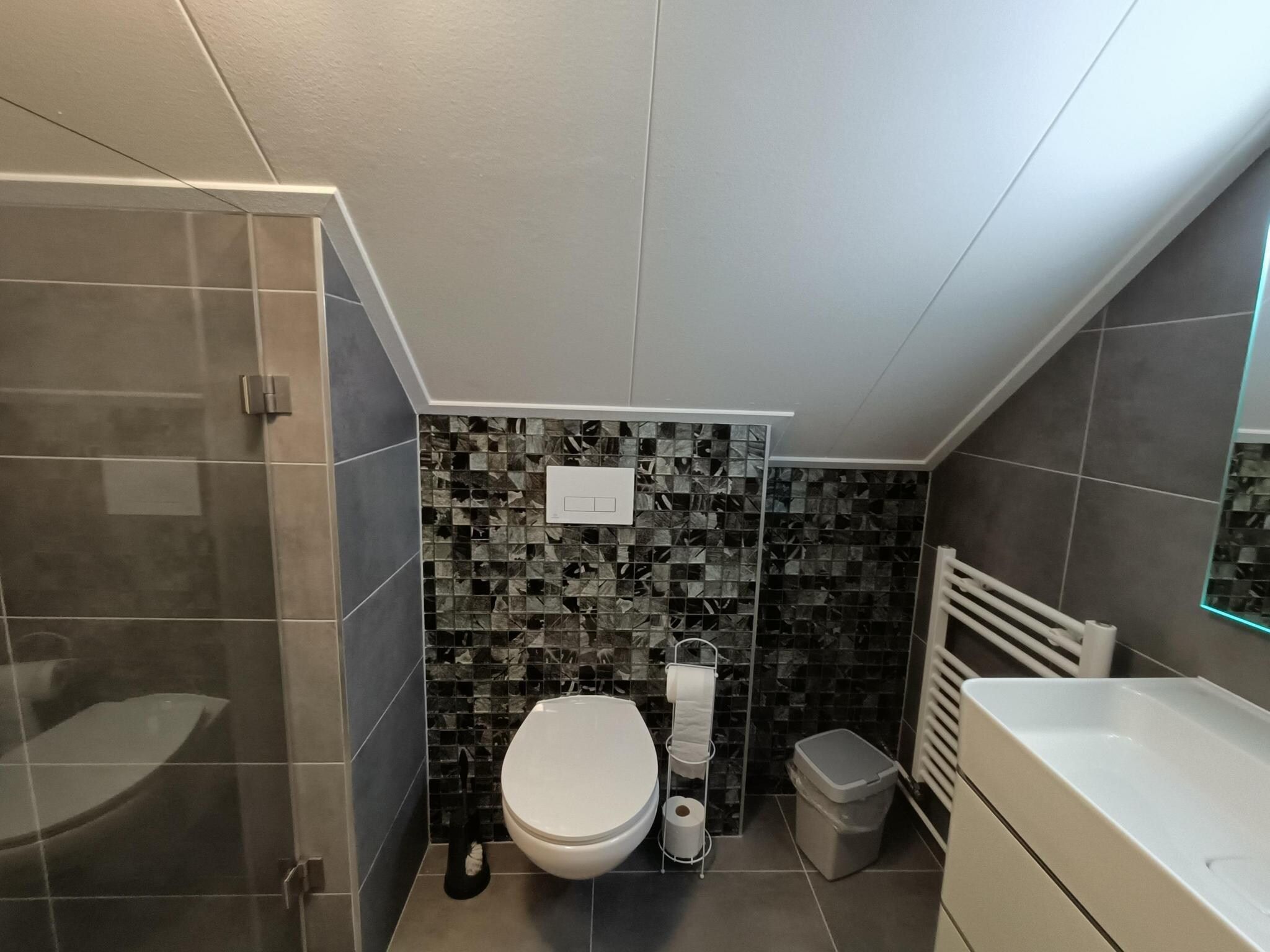 De badkamer van Vakantiepark De Rimboe & De Woeste Hoogte 3 in Hoenderloo