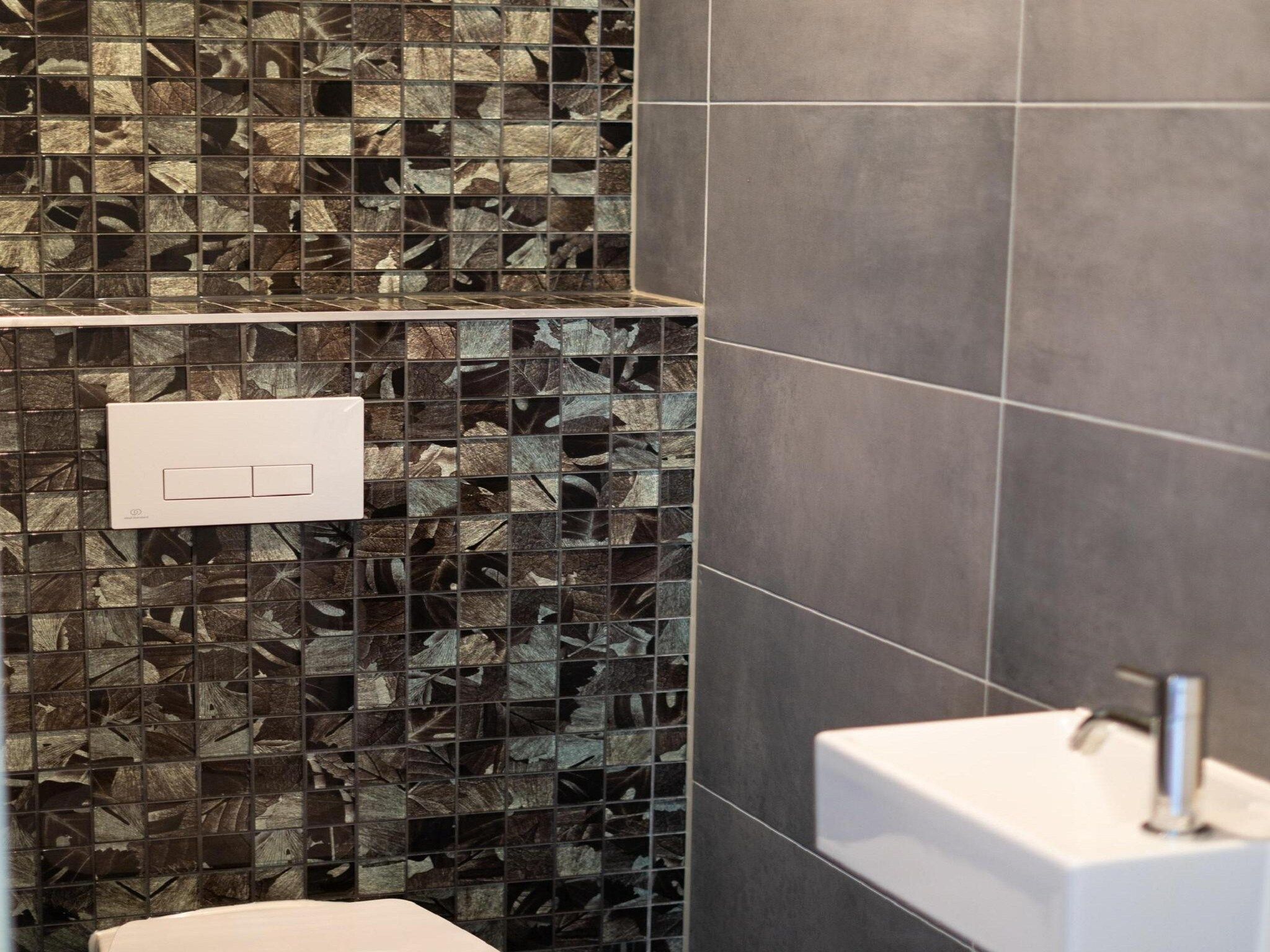 De badkamer van Vakantiepark De Rimboe & De Woeste Hoogte 3 in Hoenderloo