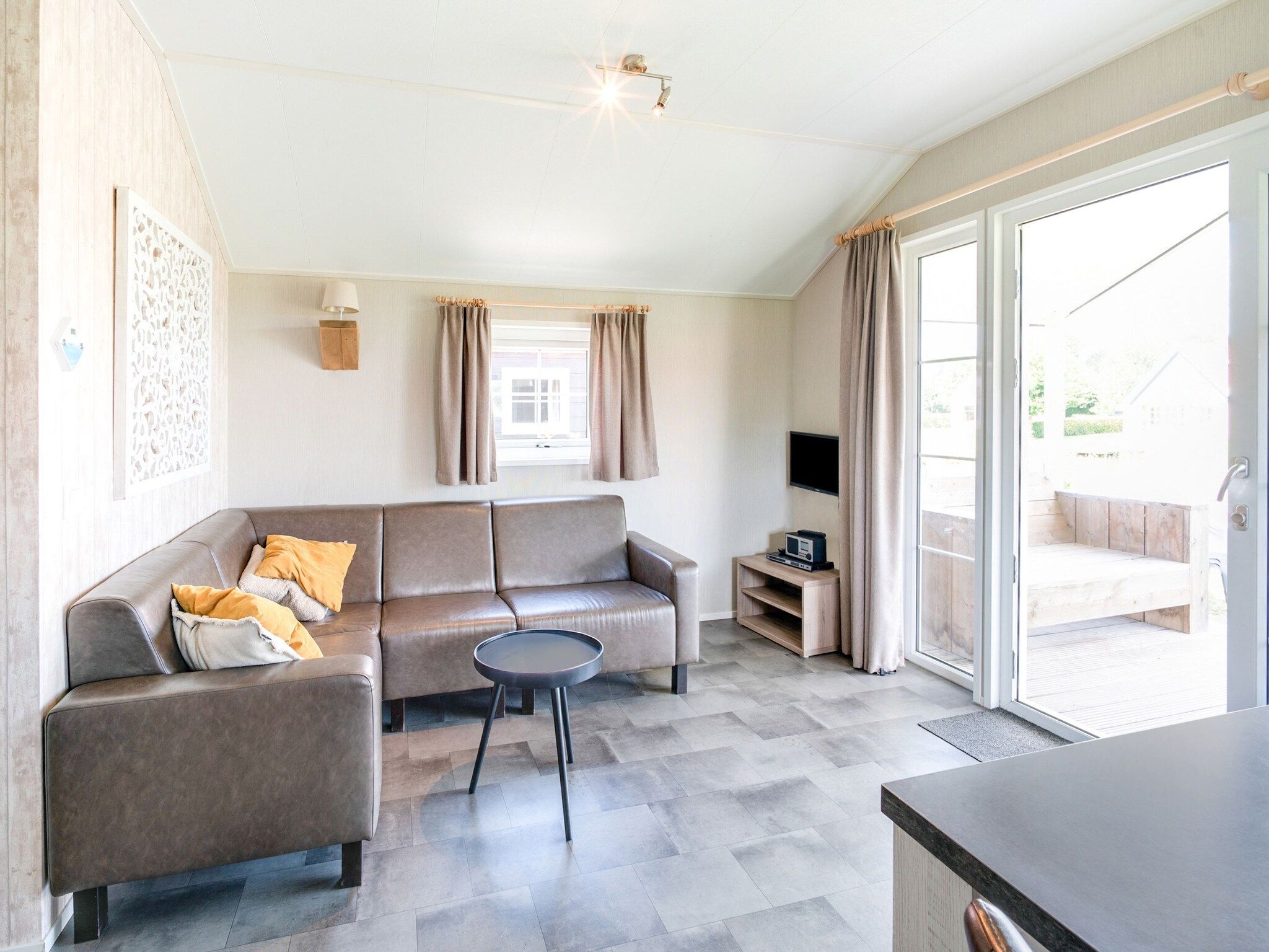 De woonkamer van Vakantiepark Eigen Wijze 6 in Bant