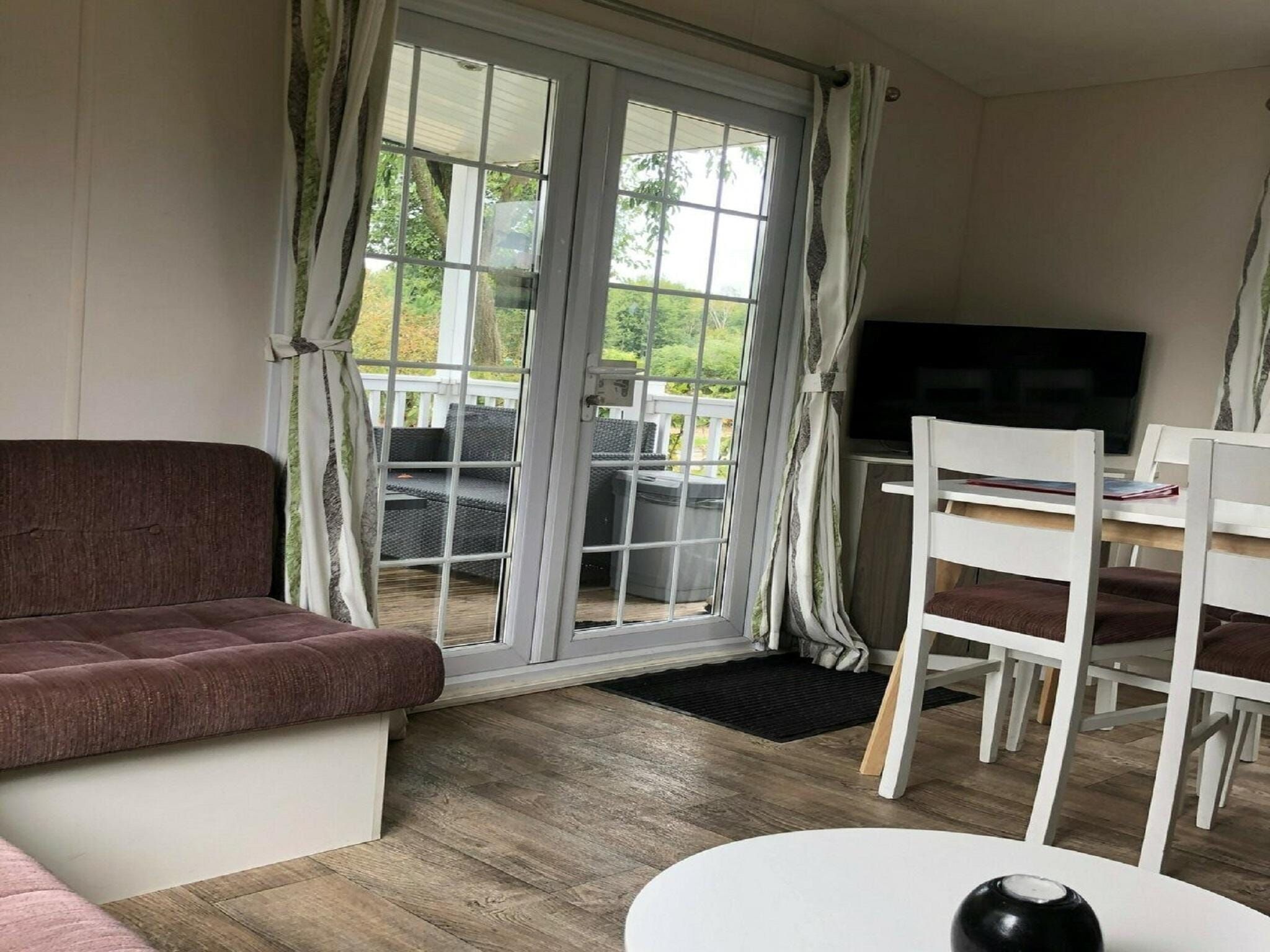 De woonkamer van Recreatiepark Duinhoeve 11 in Udenhout