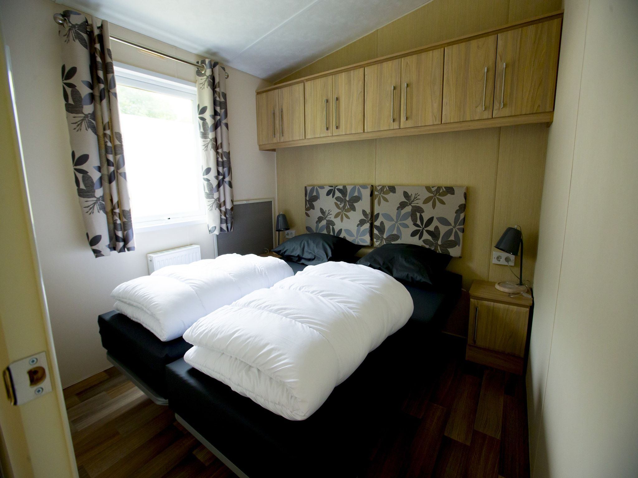 Een slaapkamer van Recreatiepark Duinhoeve 13 in Udenhout