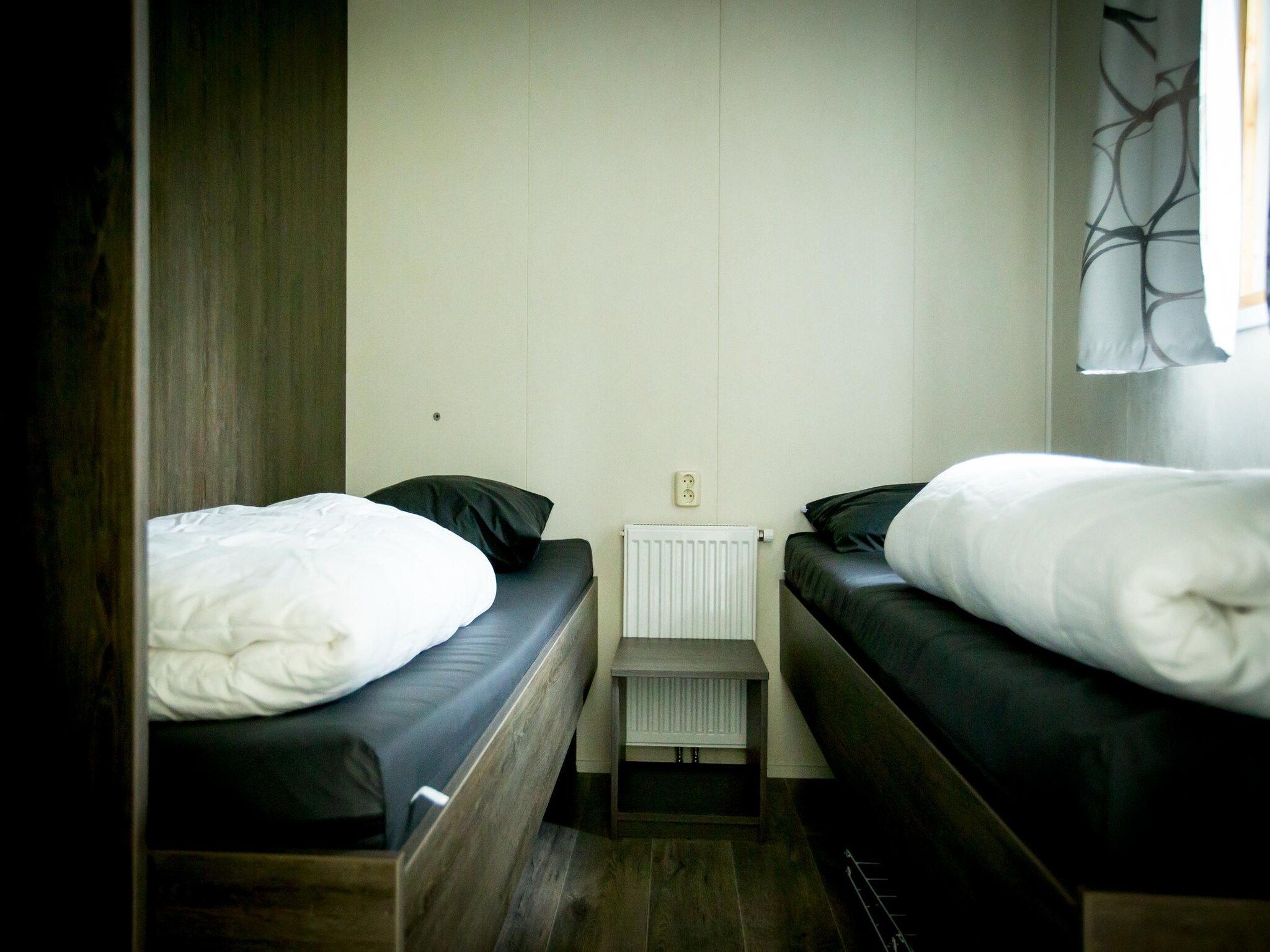 Een slaapkamer van Recreatiepark Duinhoeve 14 in Udenhout