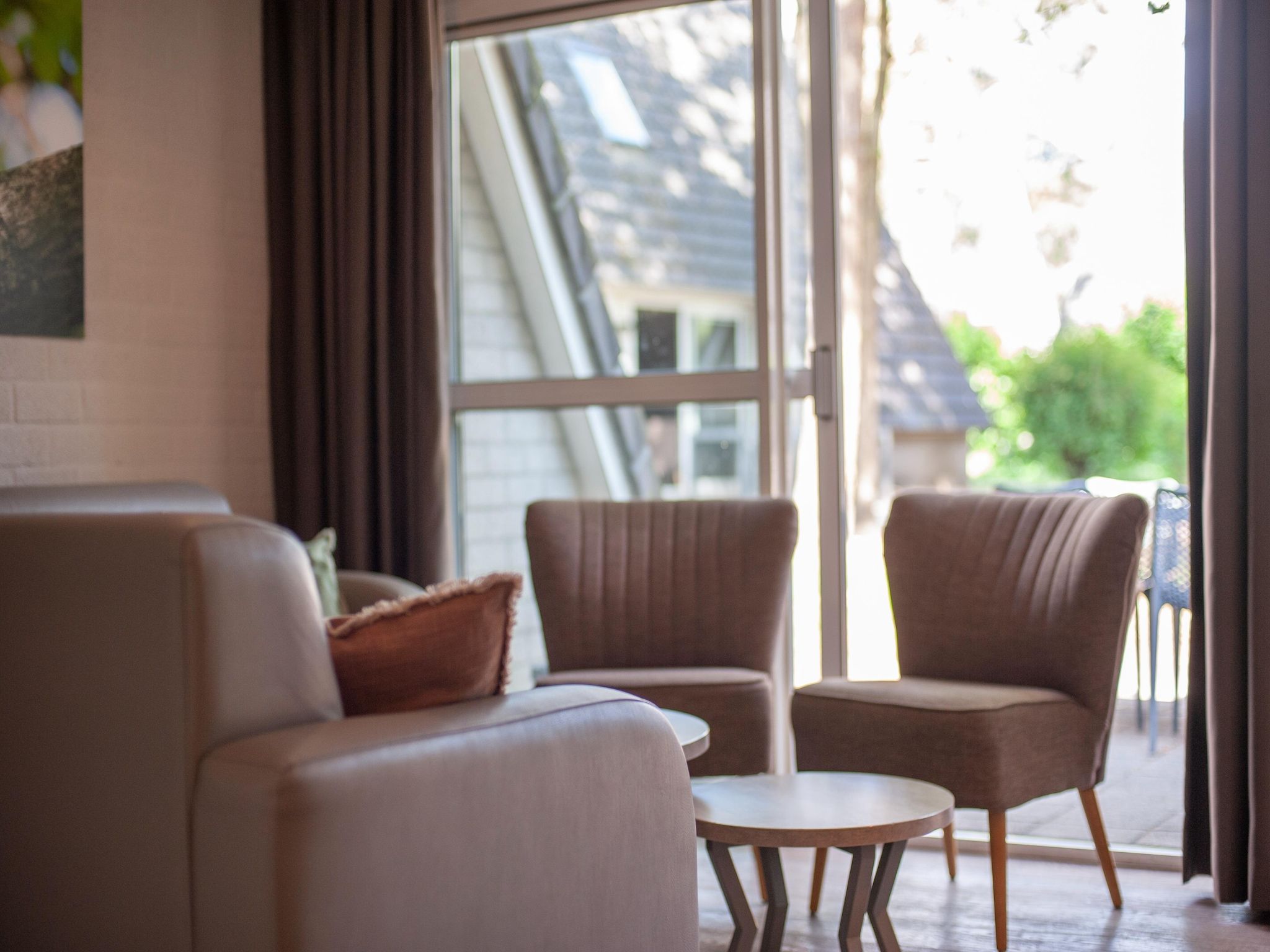 De woonkamer van Vakantiepark de Katjeskelder 10 in Oosterhout