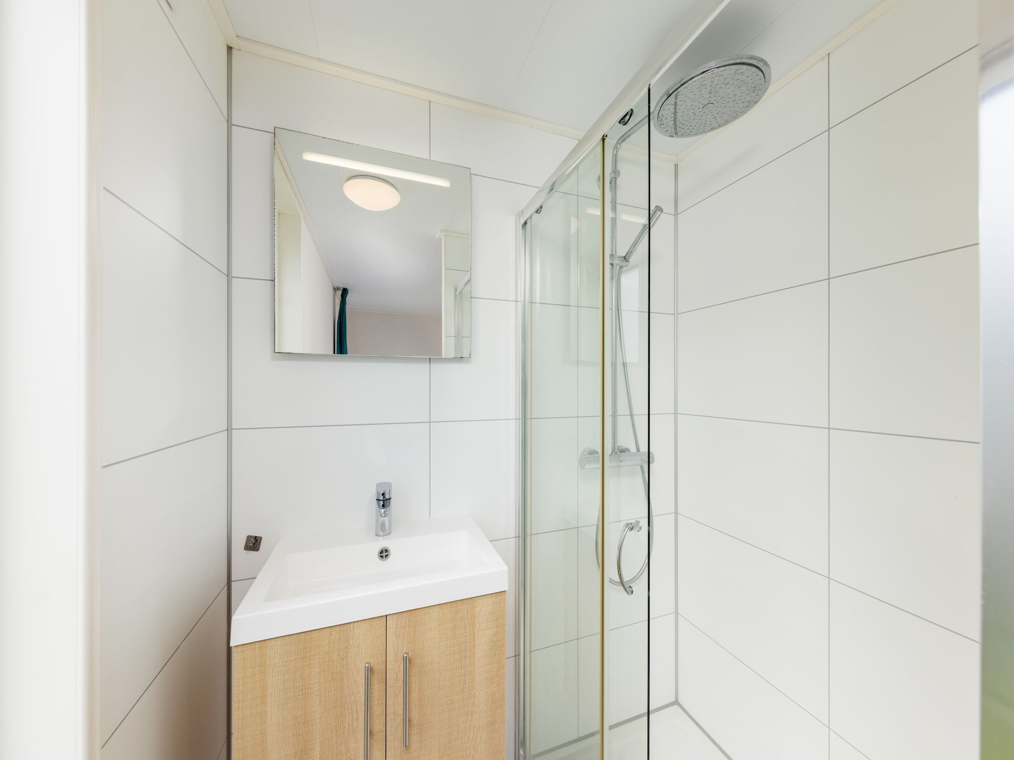 De badkamer van Vakantiepark Callassande 1 in Callantsoog