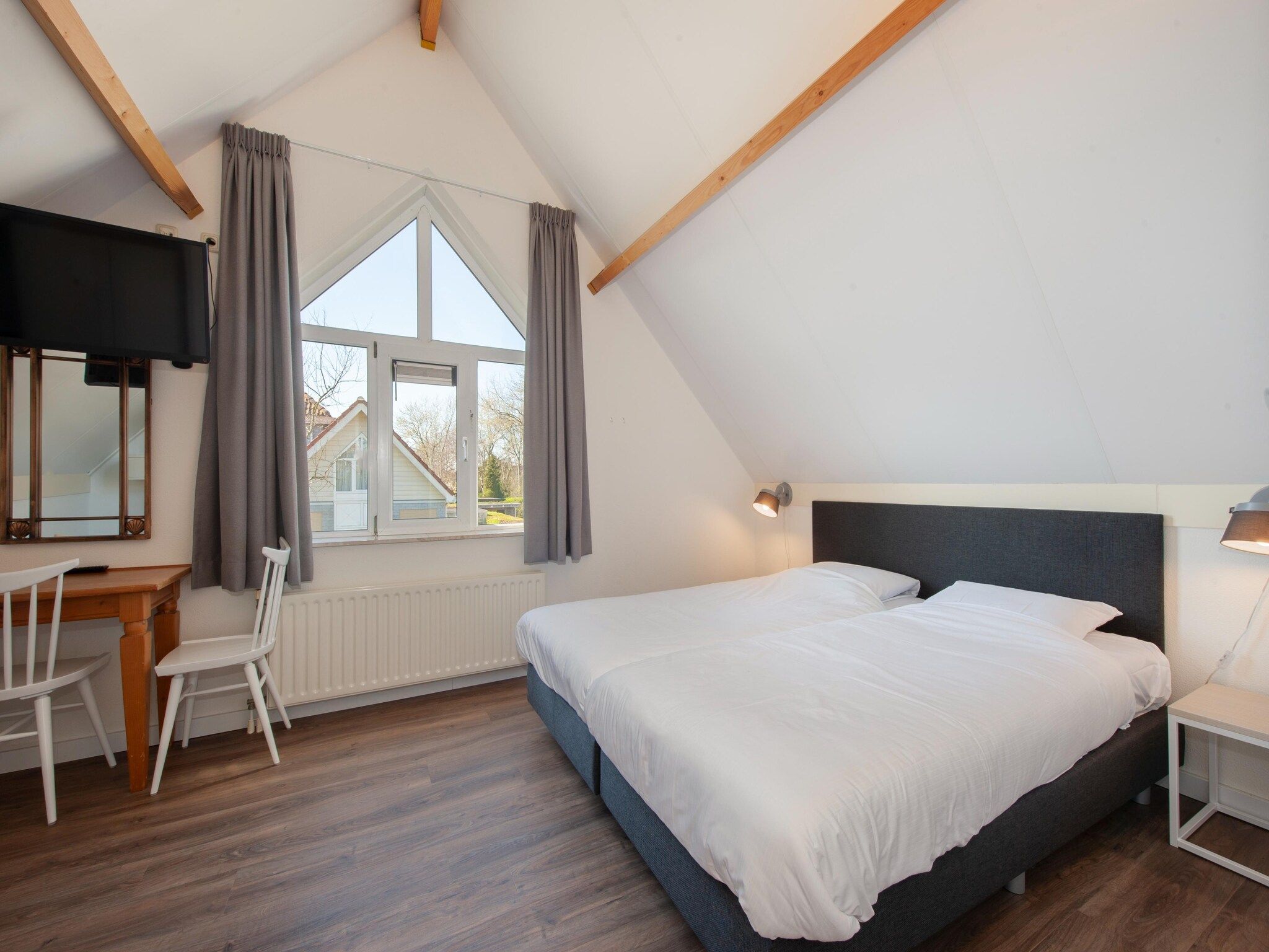 Een slaapkamer van Noordzee Résidence De Banjaard 12 in Kamperland