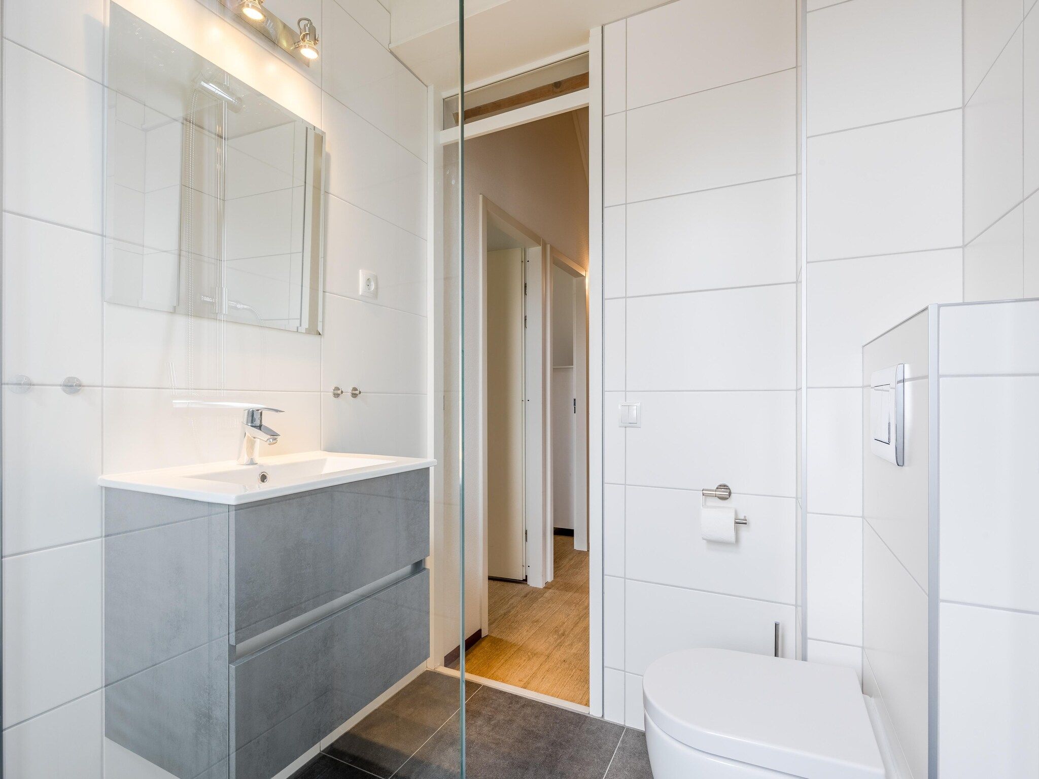 De badkamer van Noordzee Résidence De Banjaard 13 in Kamperland