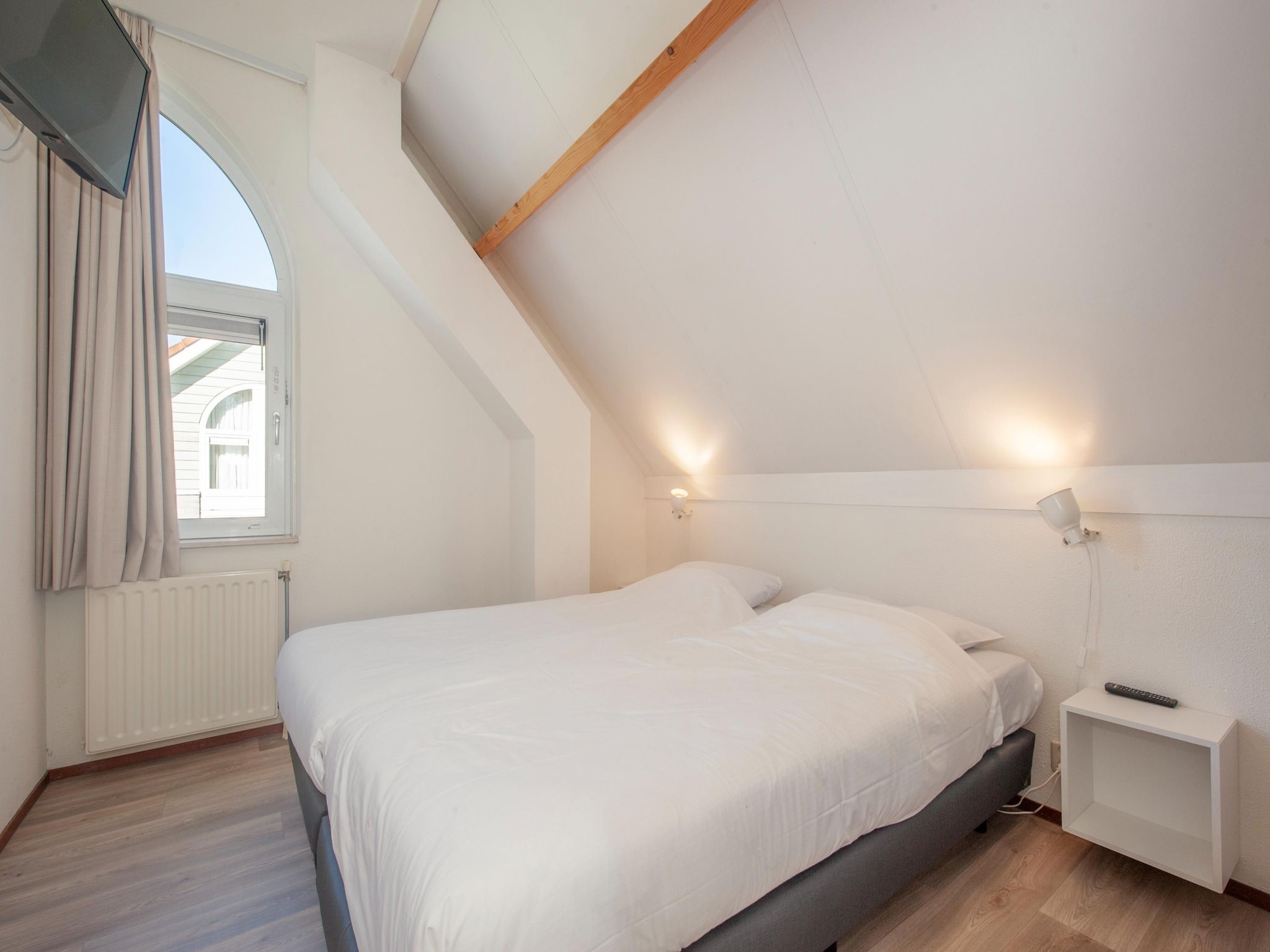 Een slaapkamer van Noordzee Résidence De Banjaard 14 in Kamperland