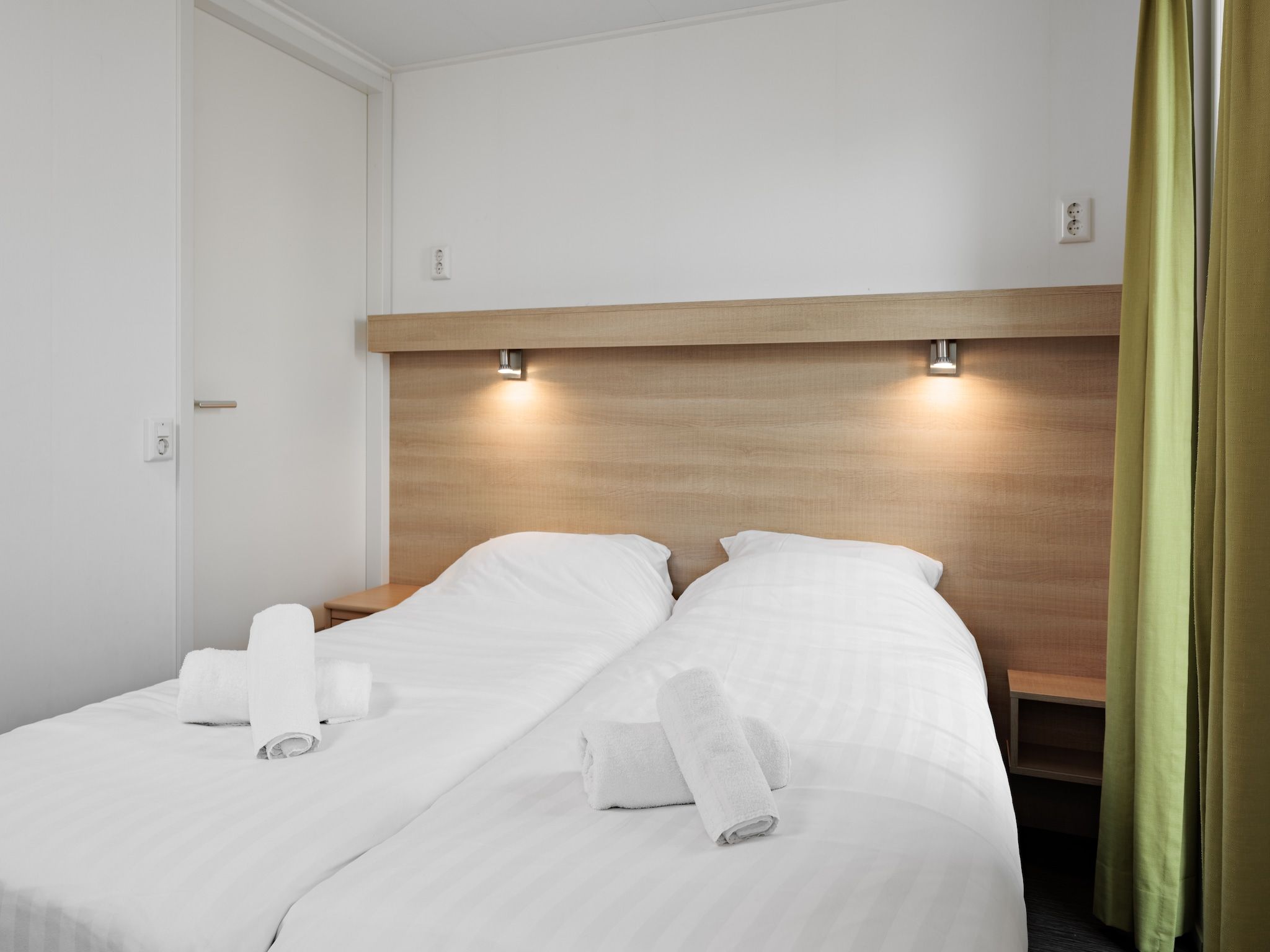 Een slaapkamer van Vakantiepark Zeebad 5 in Breskens