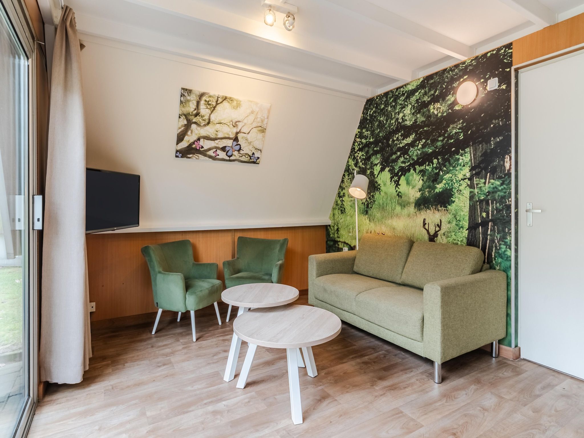 De woonkamer van Bospark 't Wolfsven 7 in Mierlo