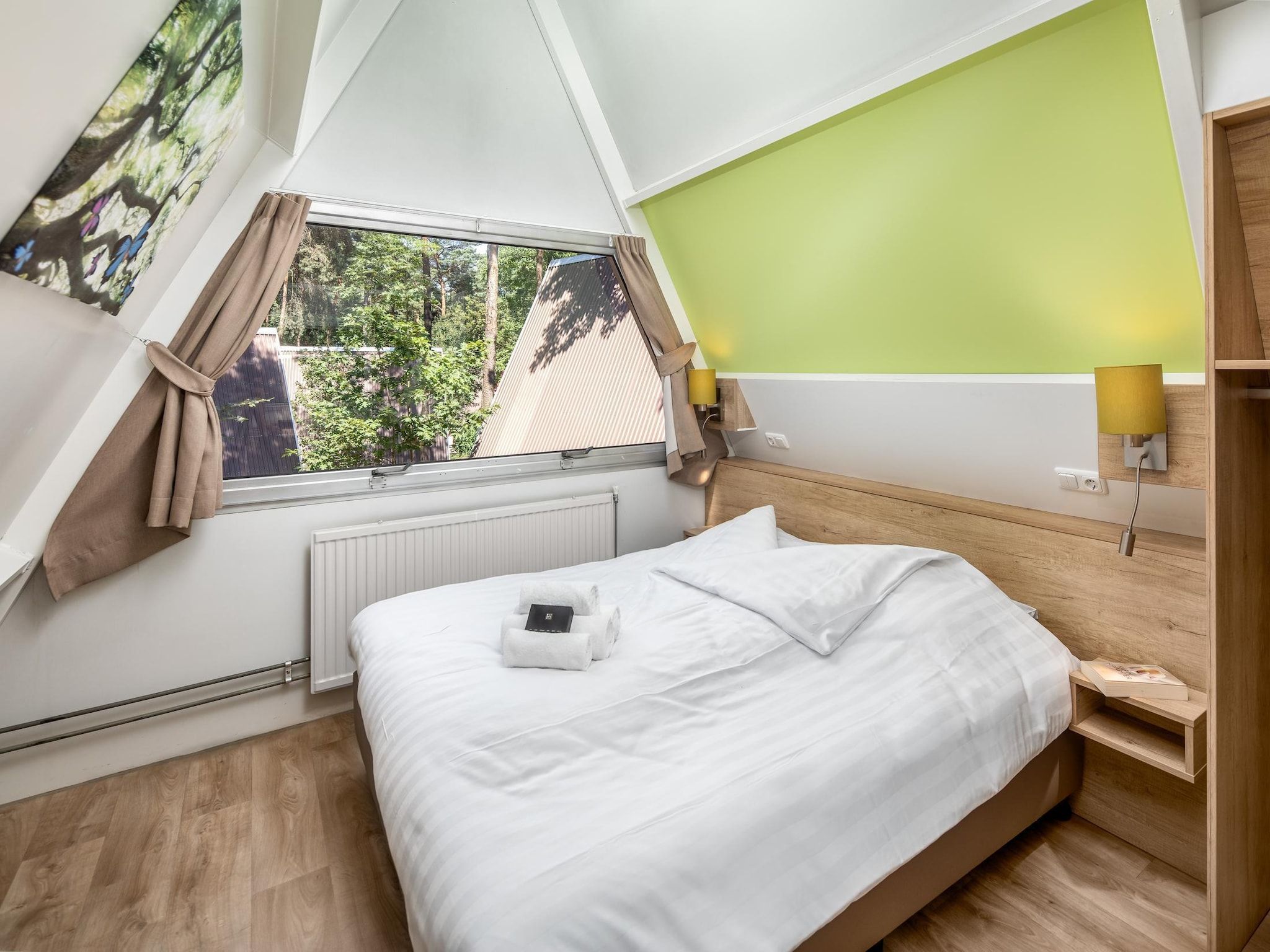 Een slaapkamer van Bospark 't Wolfsven 8 in Mierlo