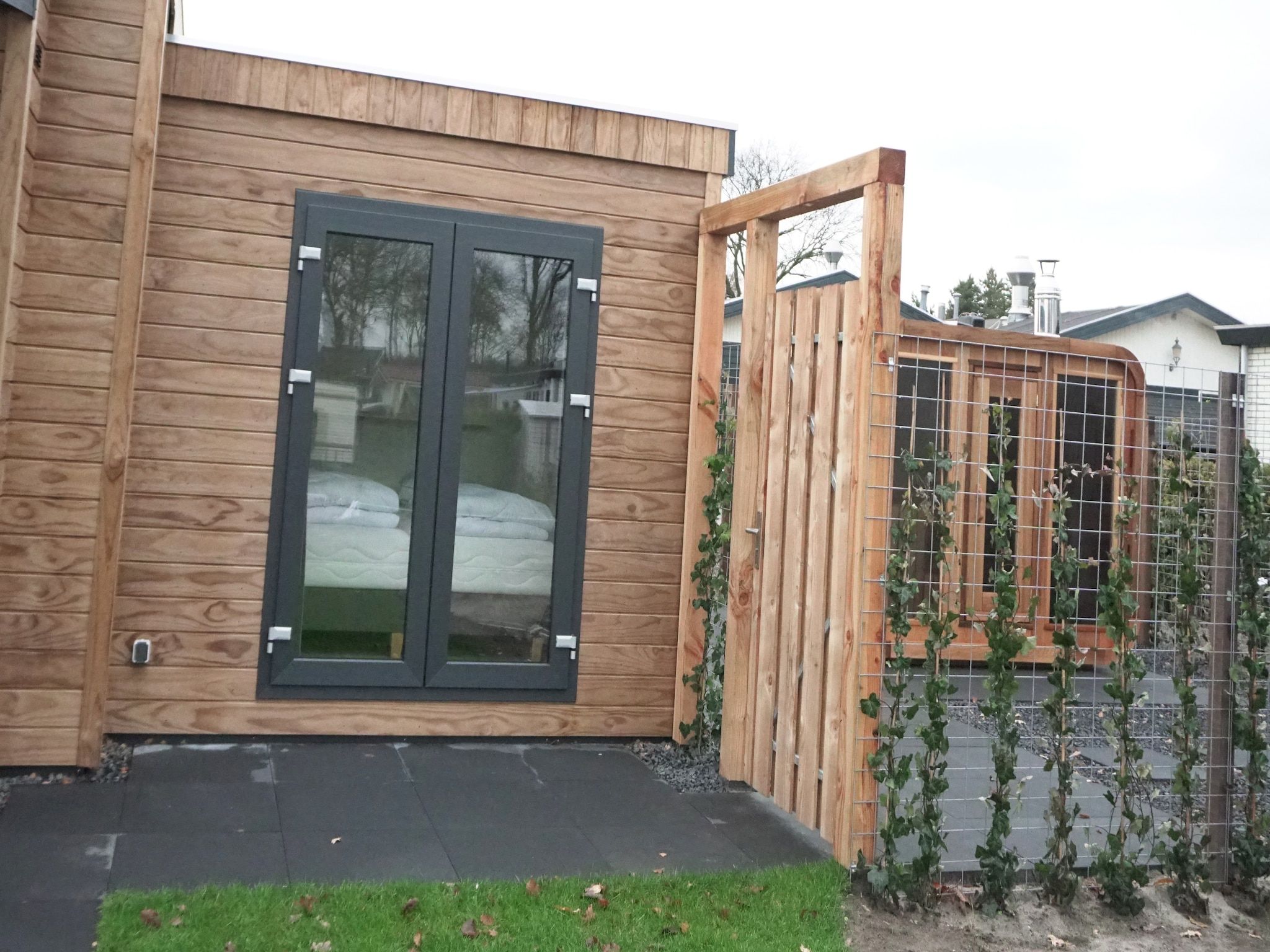 De tuin van Recreatiepark de Boshoek 21 in Voorthuizen