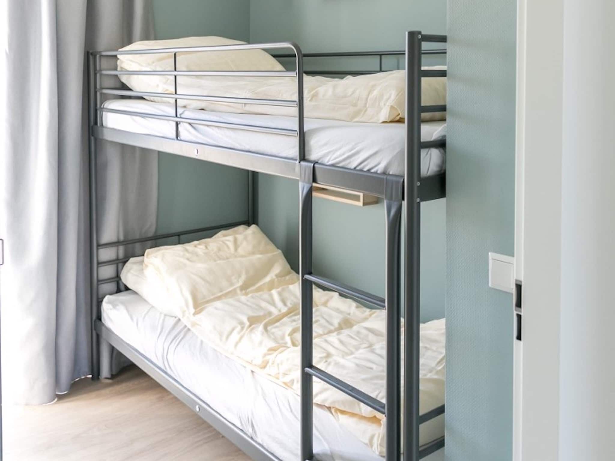 Een slaapkamer van Strandpark Vlugtenburg 7 in 's-Gravenzande