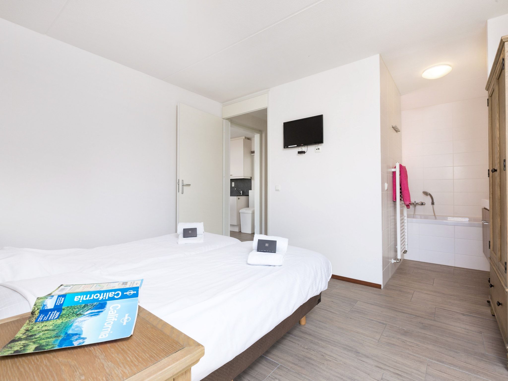 Een slaapkamer van Strandpark Duynhille 1 in Ouddorp