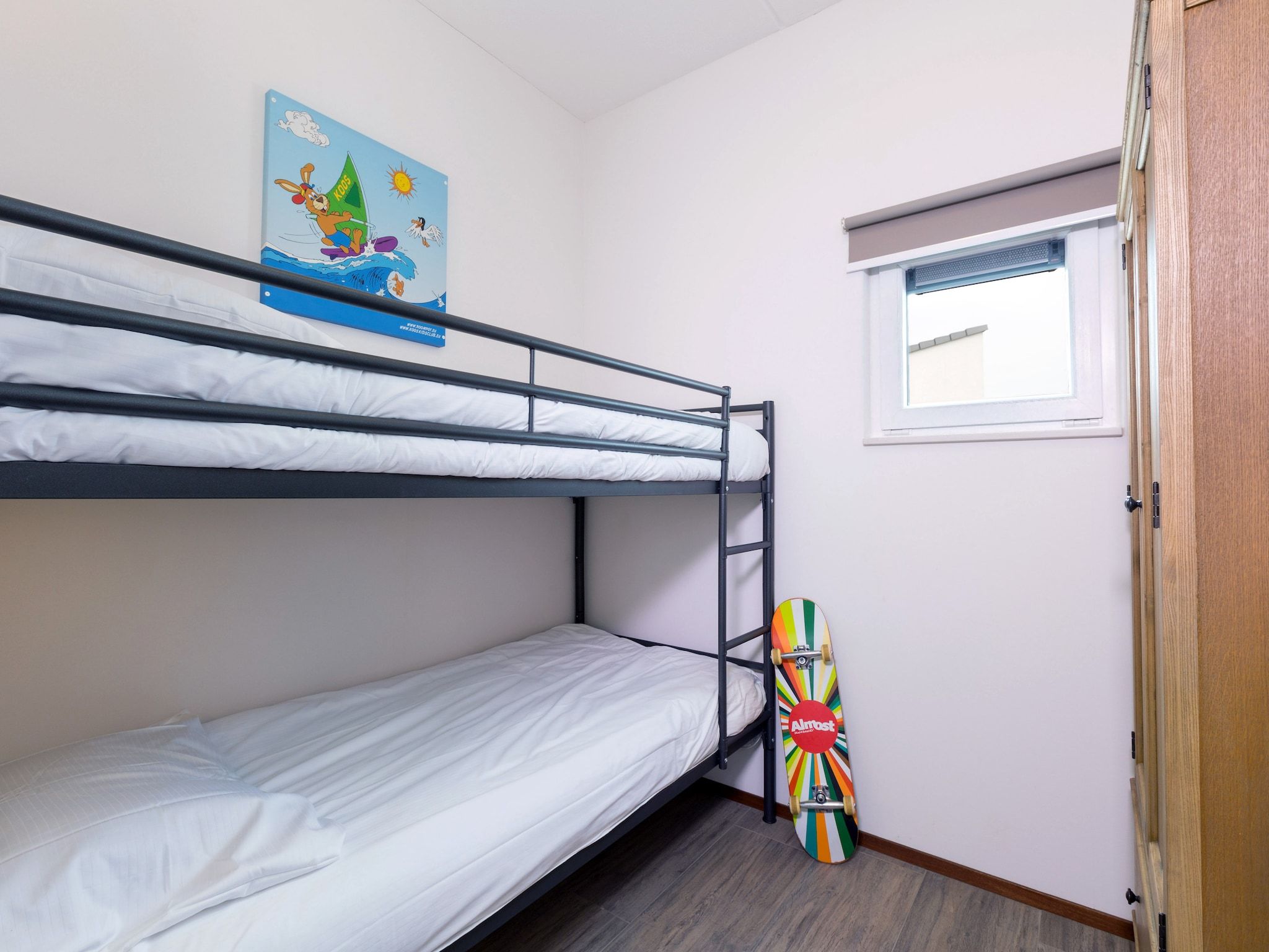 Een slaapkamer van Strandpark Duynhille 3 in Ouddorp