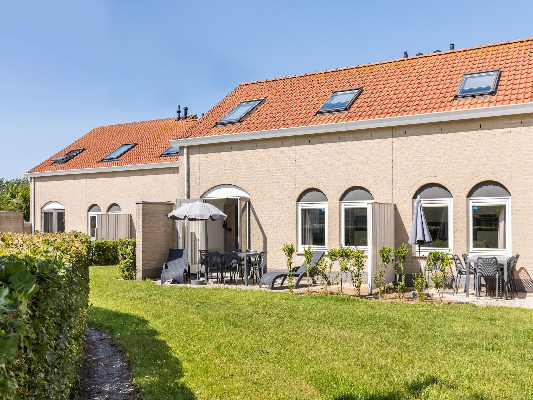 De tuin van Vakantiepark de Soeten Haert 18 in Renesse