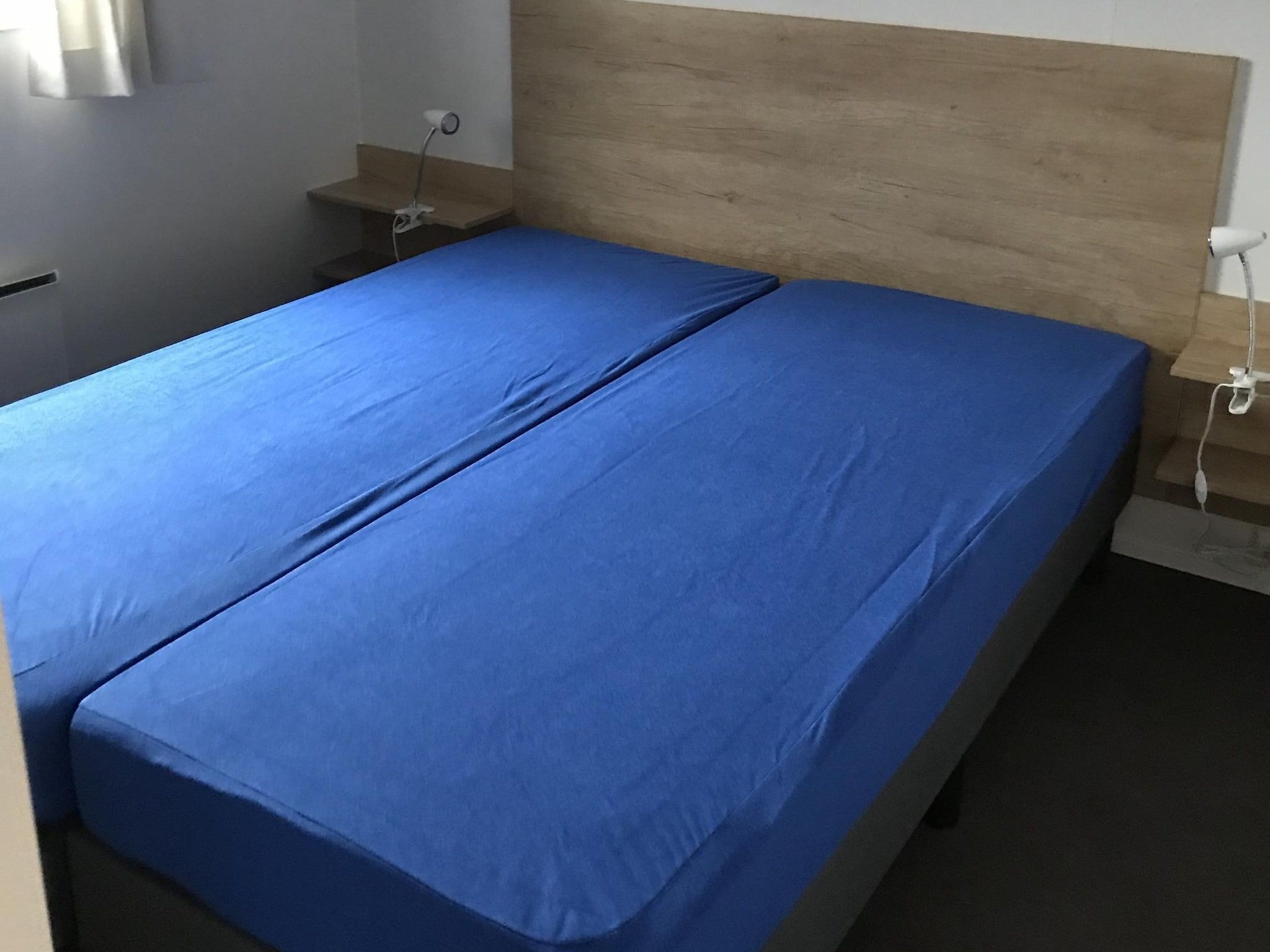 Een slaapkamer van Vakantiepark de Tabaksschuur 3 in Elst