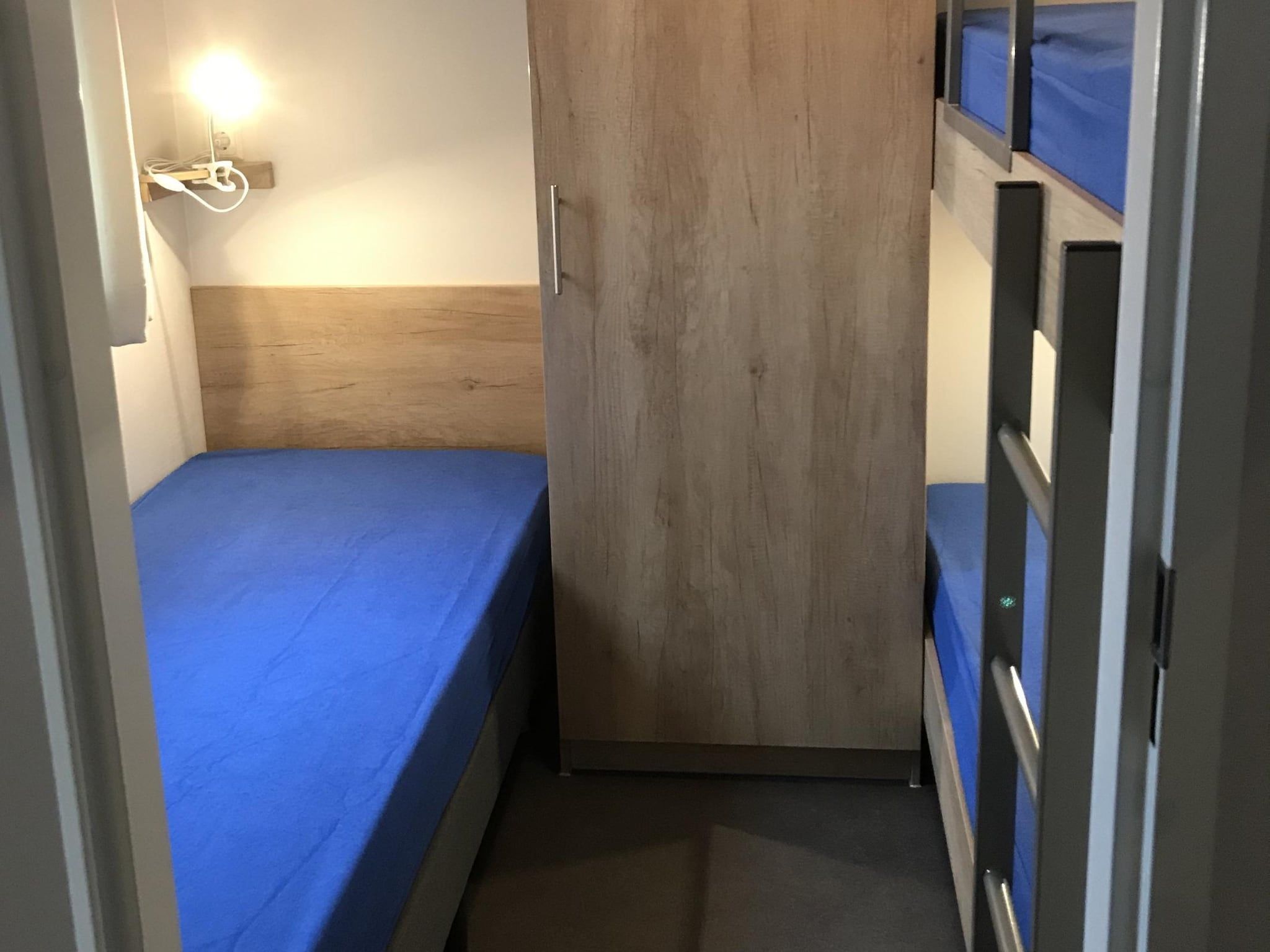 Een slaapkamer van Vakantiepark de Tabaksschuur 3 in Elst