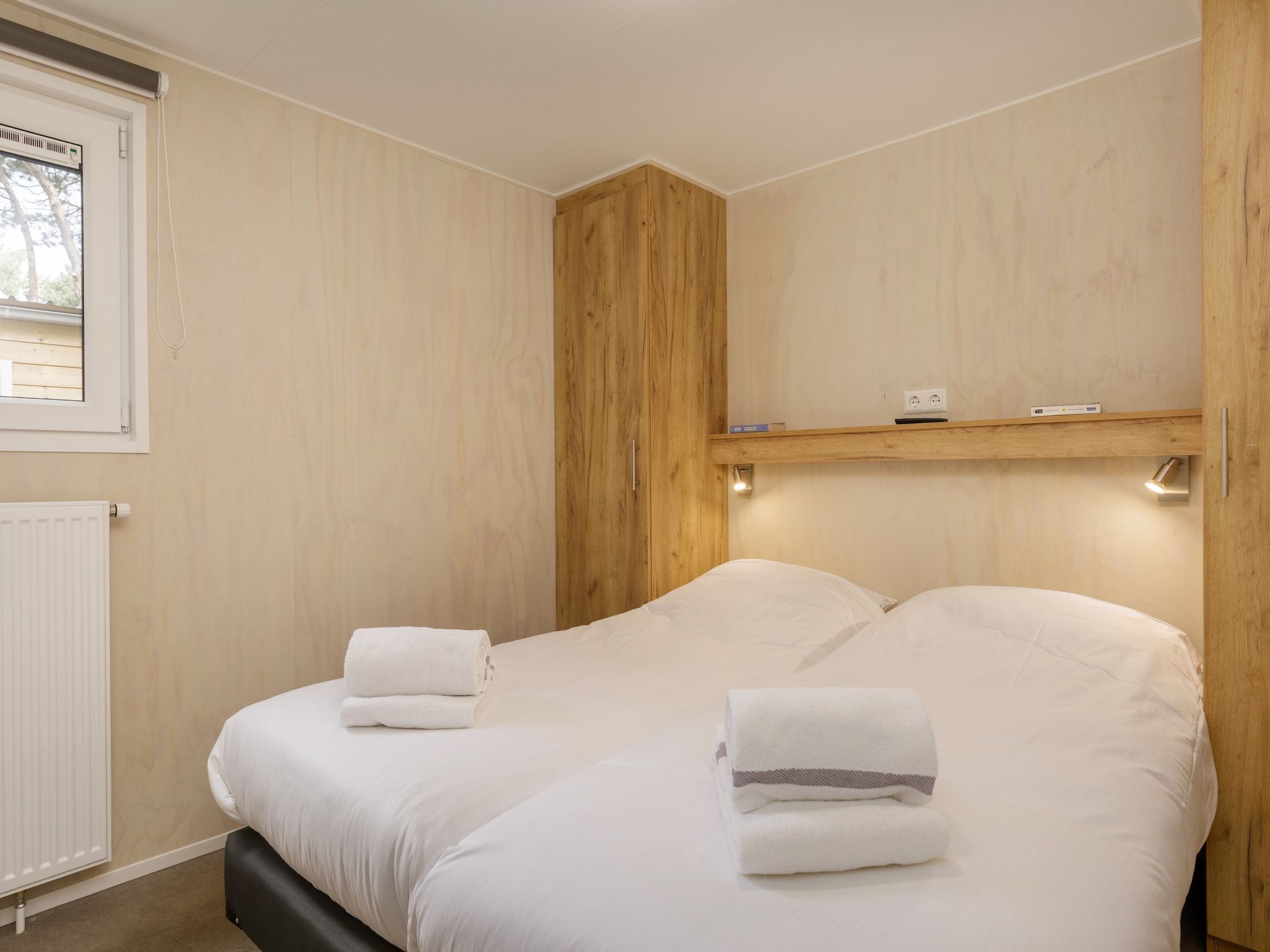 Een slaapkamer van Vakantiepark Kijkduin 9 in Den Haag