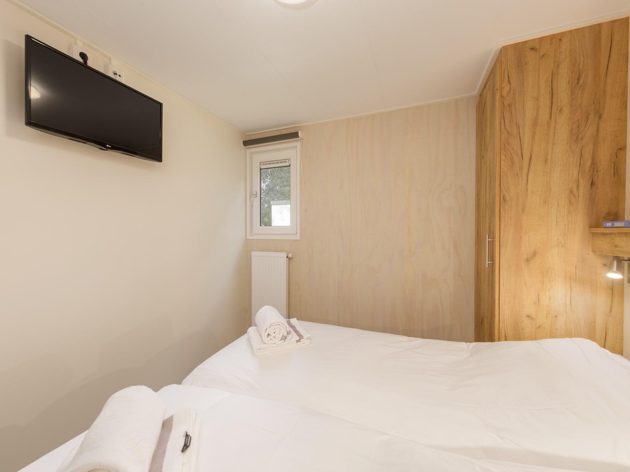 Een slaapkamer van Vakantiepark Kijkduin 10 in Den Haag