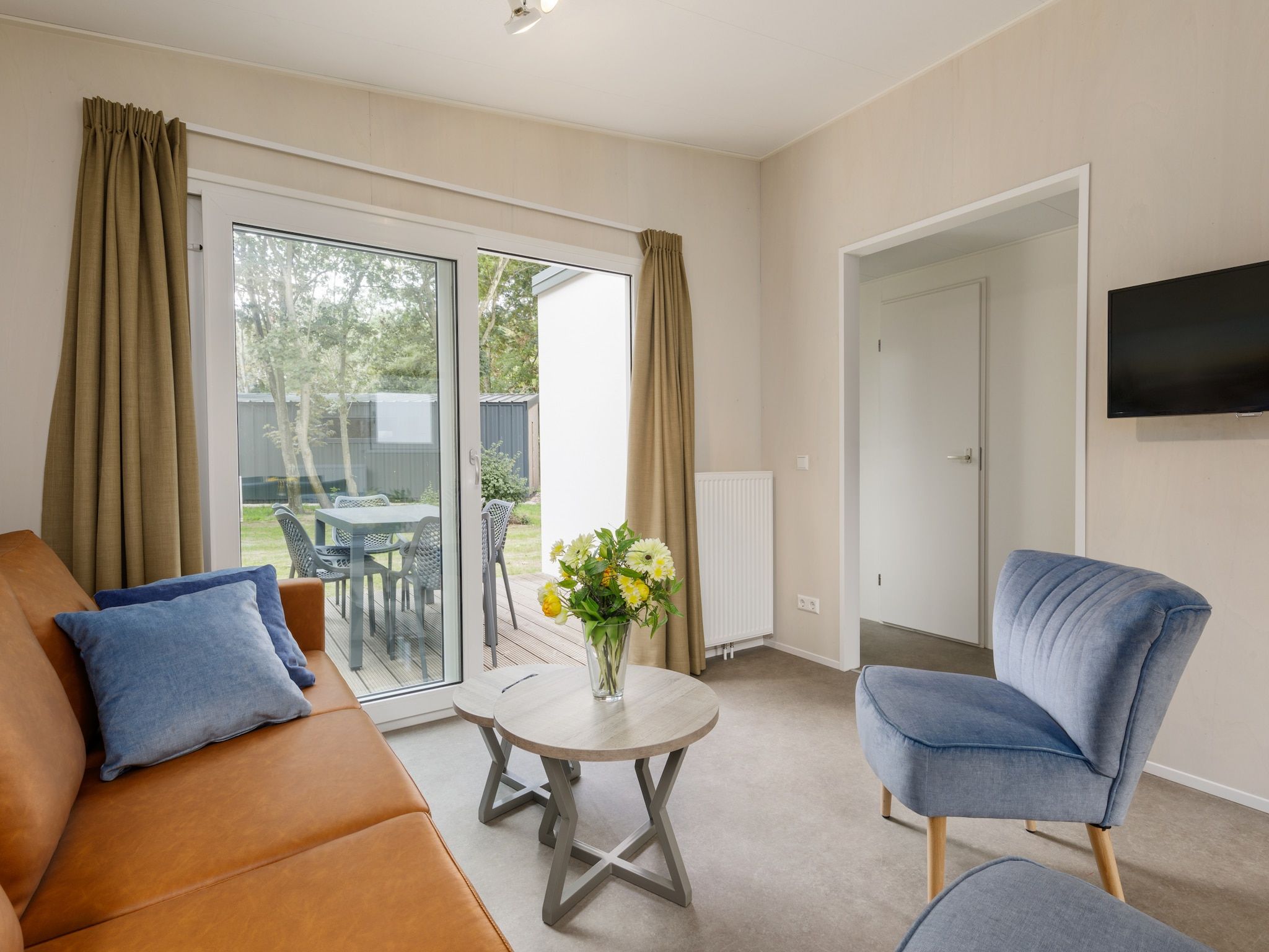 De woonkamer van Vakantiepark Kijkduin 11 in Den Haag