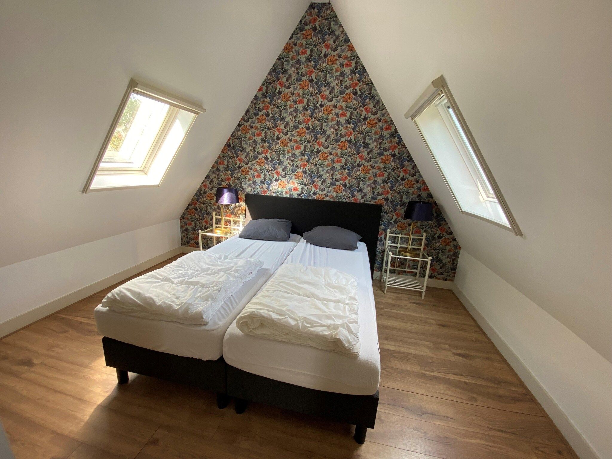 Een slaapkamer van Recreatiepark Wiringherlant - Villa 18 in Hippolytushoef