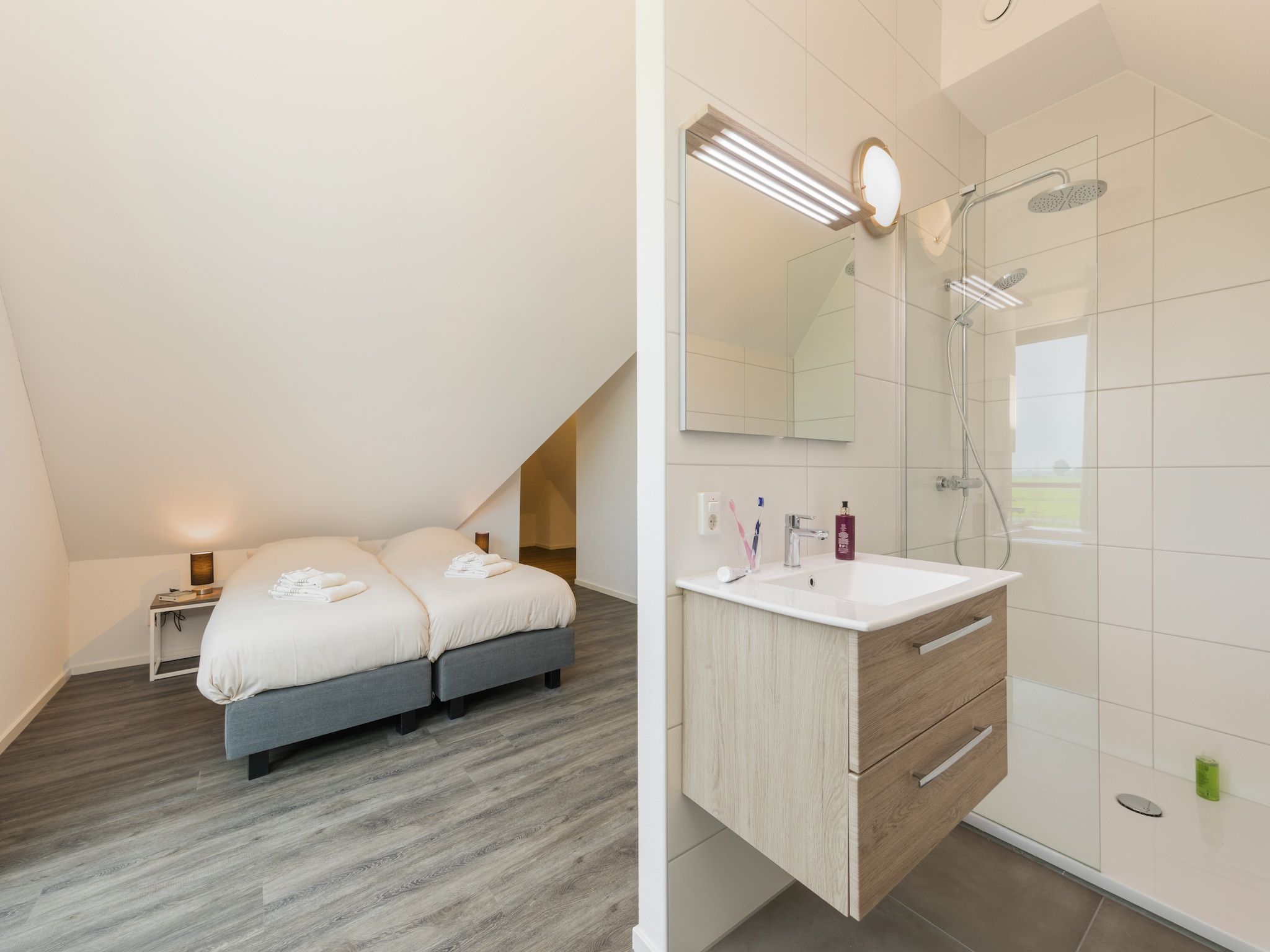 Een slaapkamer van Waterstaete Ossenzijl 2 in Ossenzijl