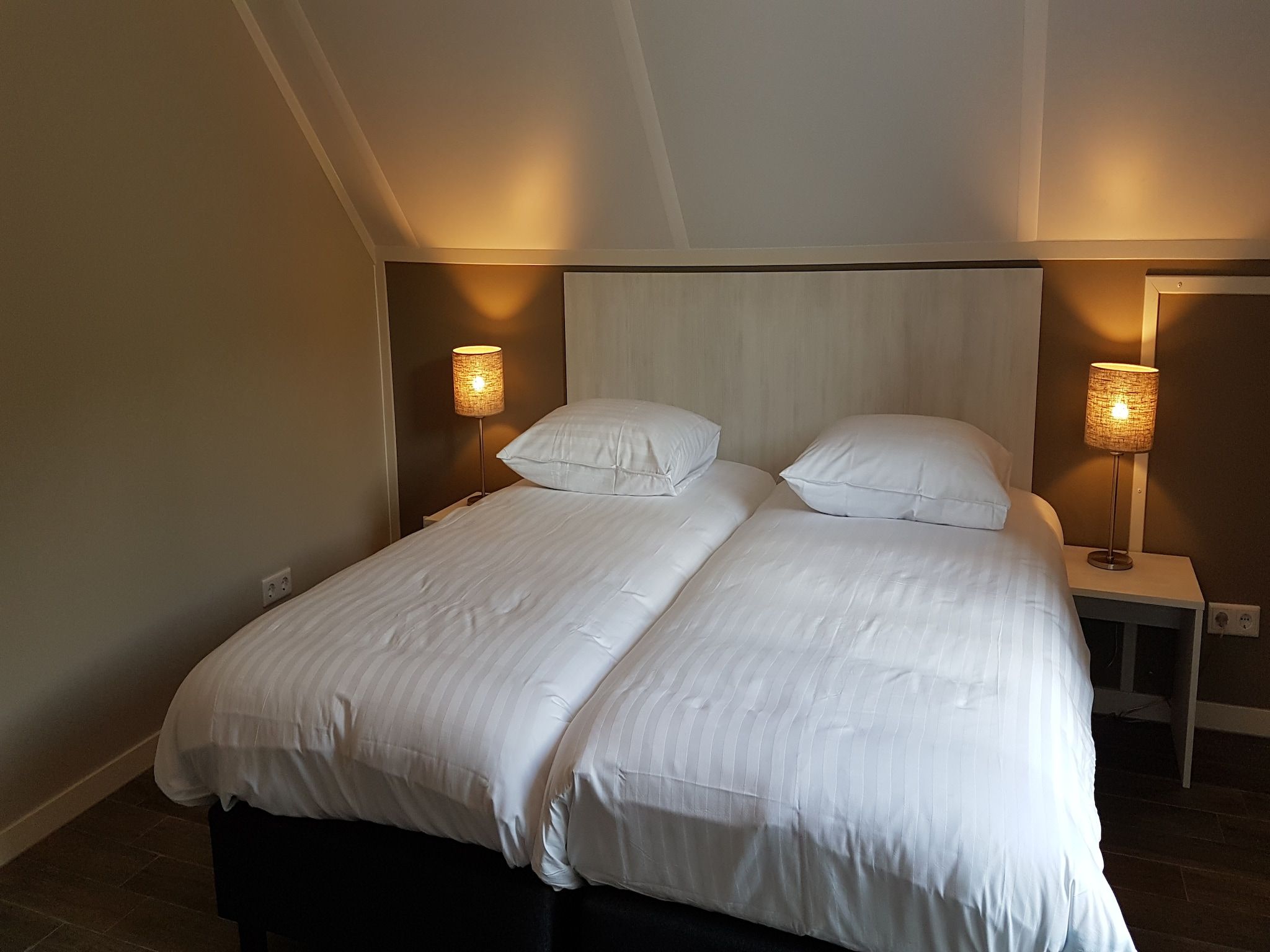 Een slaapkamer van Villapark Ehzerburg 1 in Almen