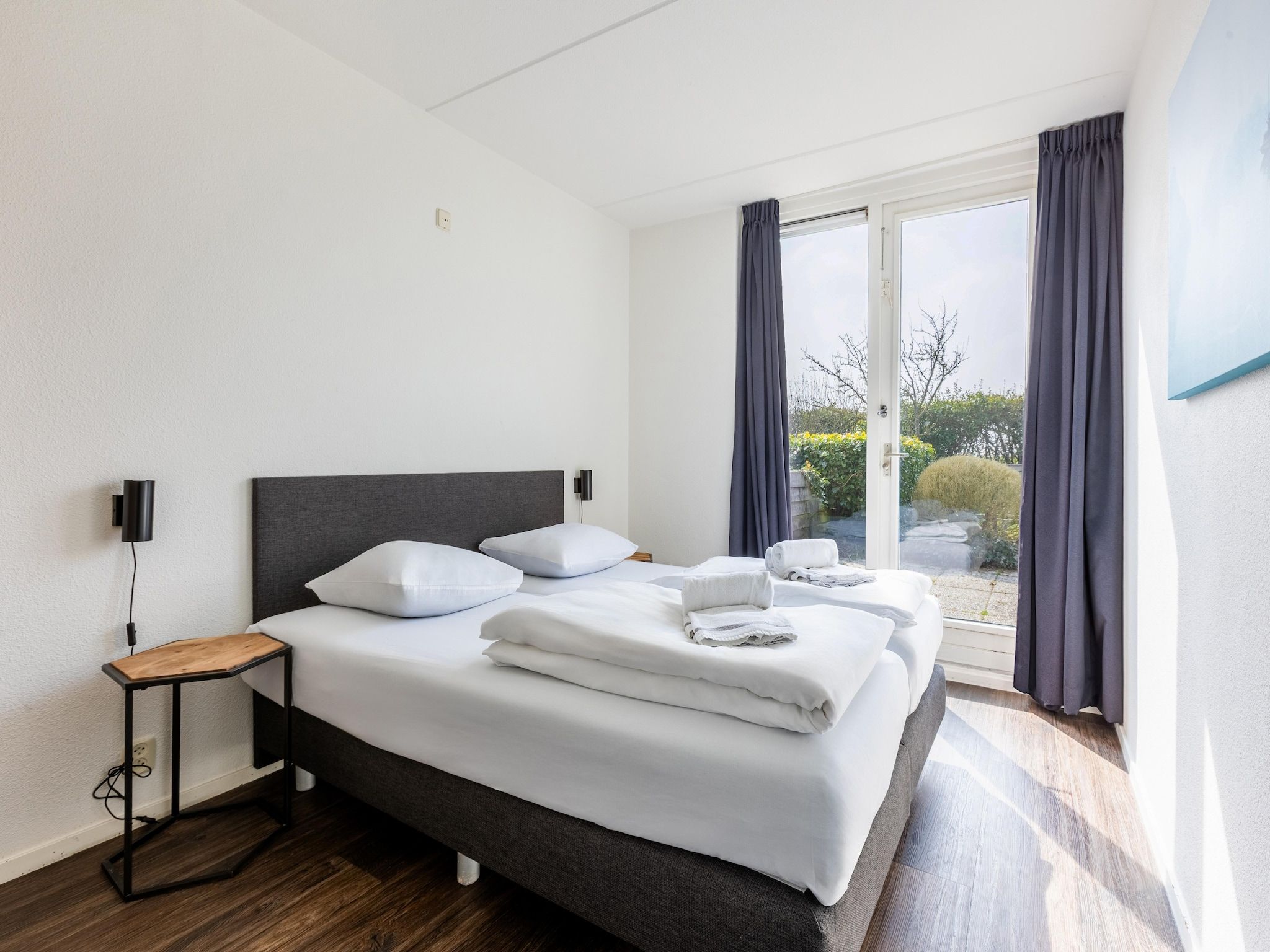 Een slaapkamer van Roompot Beach Resort 21 in Kamperland