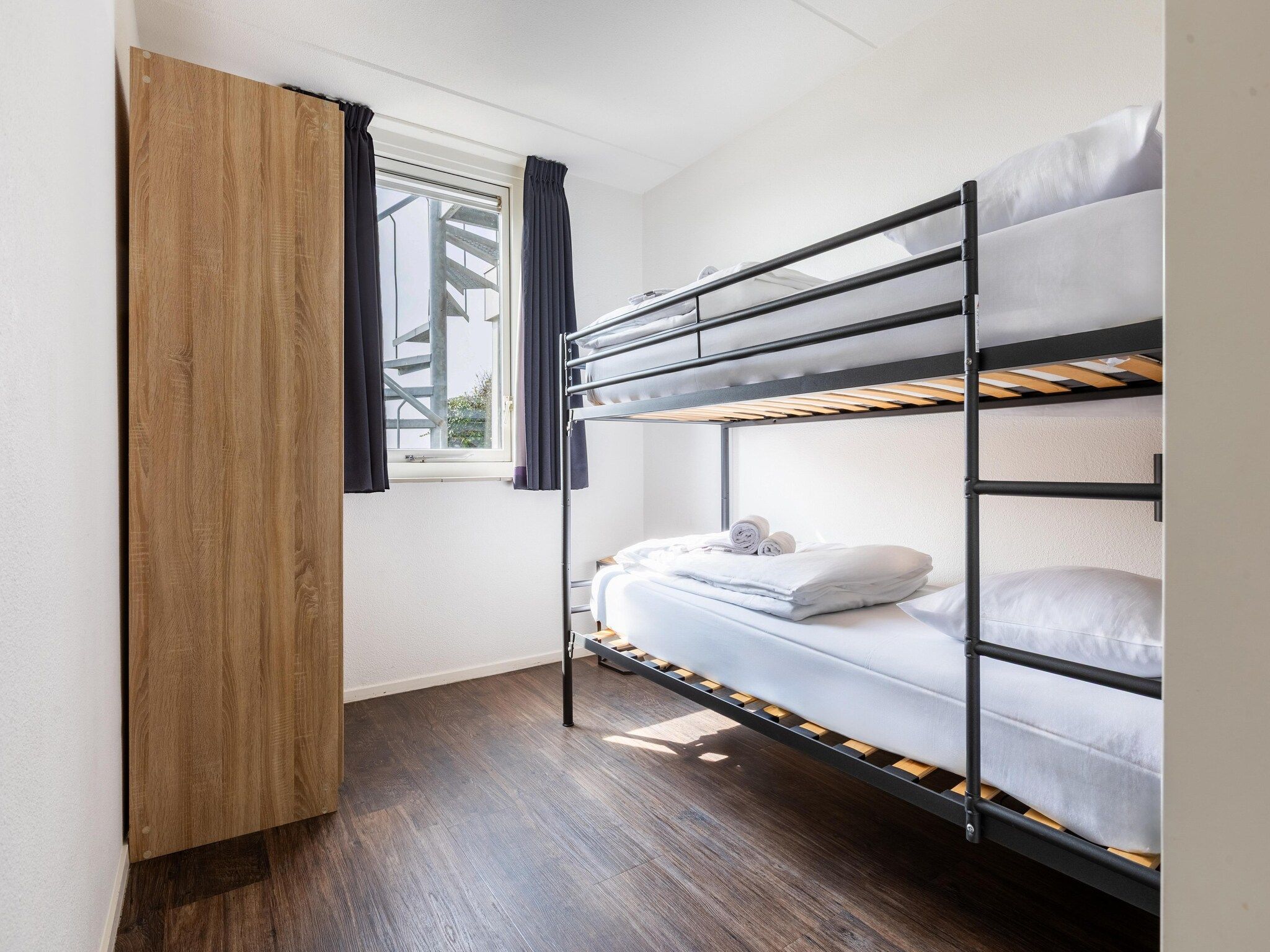 Een slaapkamer van Roompot Beach Resort 21 in Kamperland