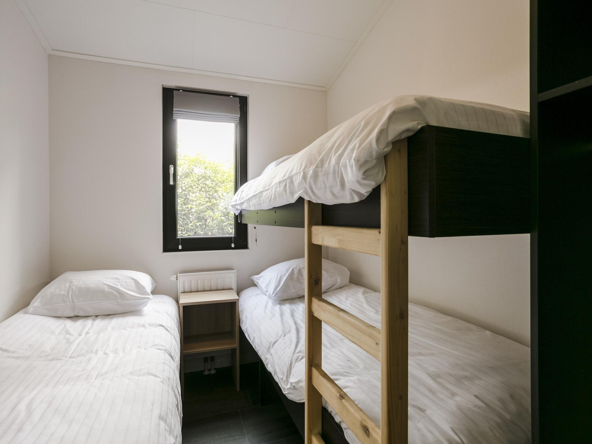 Een slaapkamer van Bospark Markelo 3 in Markelo