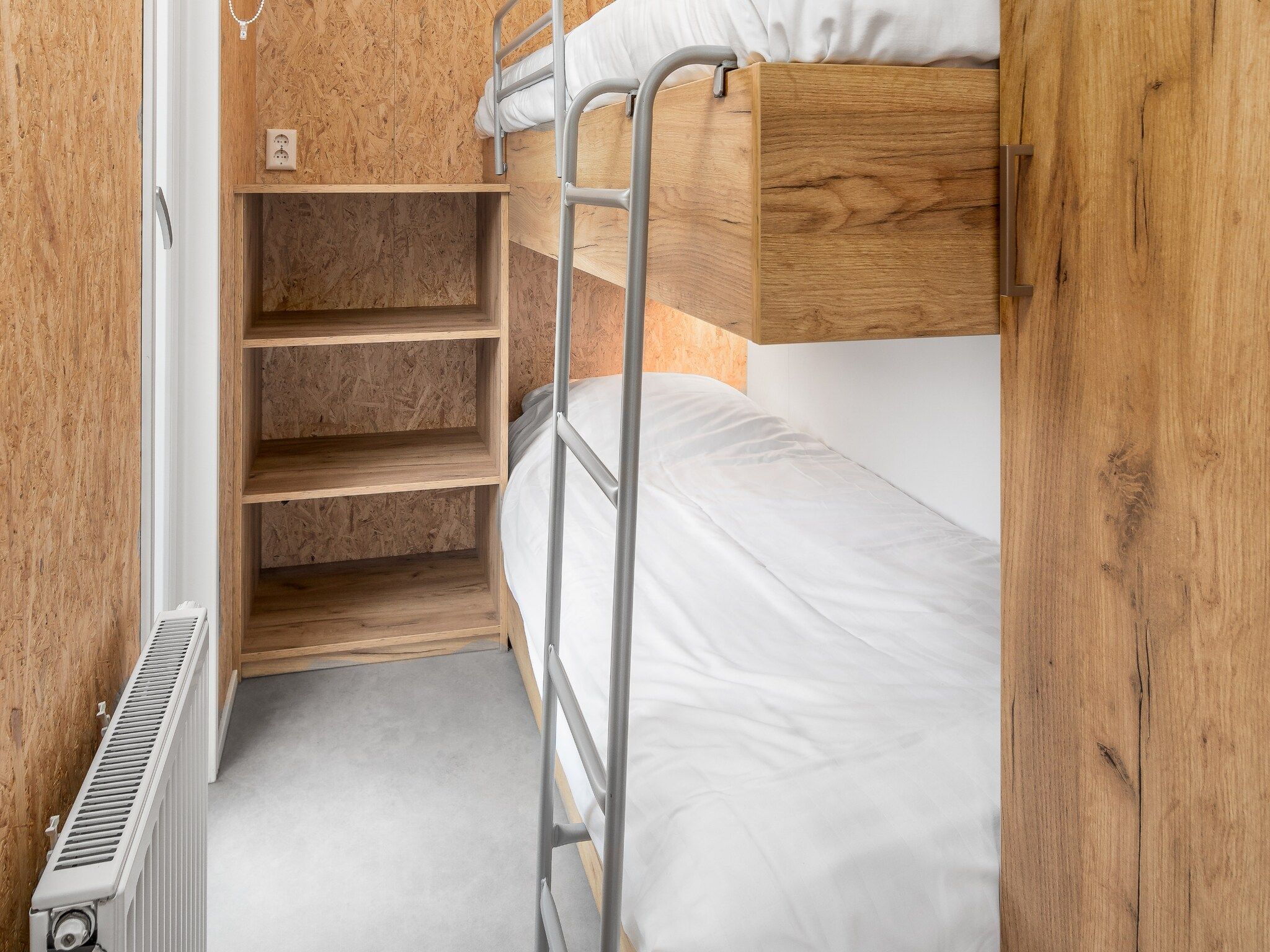 Een slaapkamer van Vakantiepark Hunzedal 12 in Borger