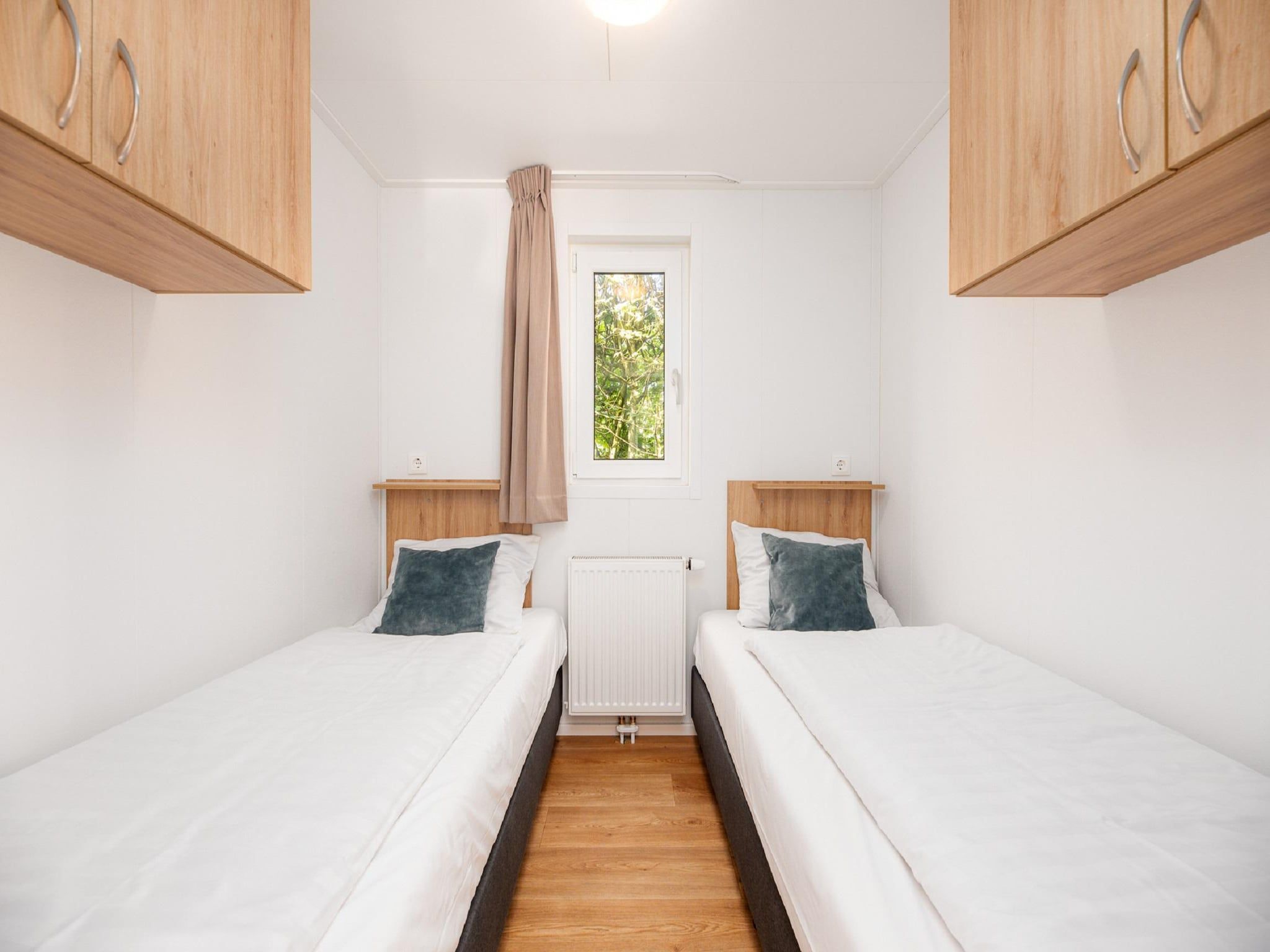 Een slaapkamer van Vakantiepark Mölke 20 in Zuna