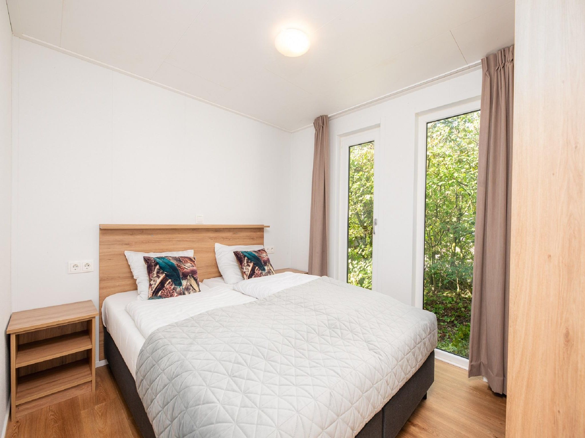 Een slaapkamer van Vakantiepark Mölke 20 in Zuna